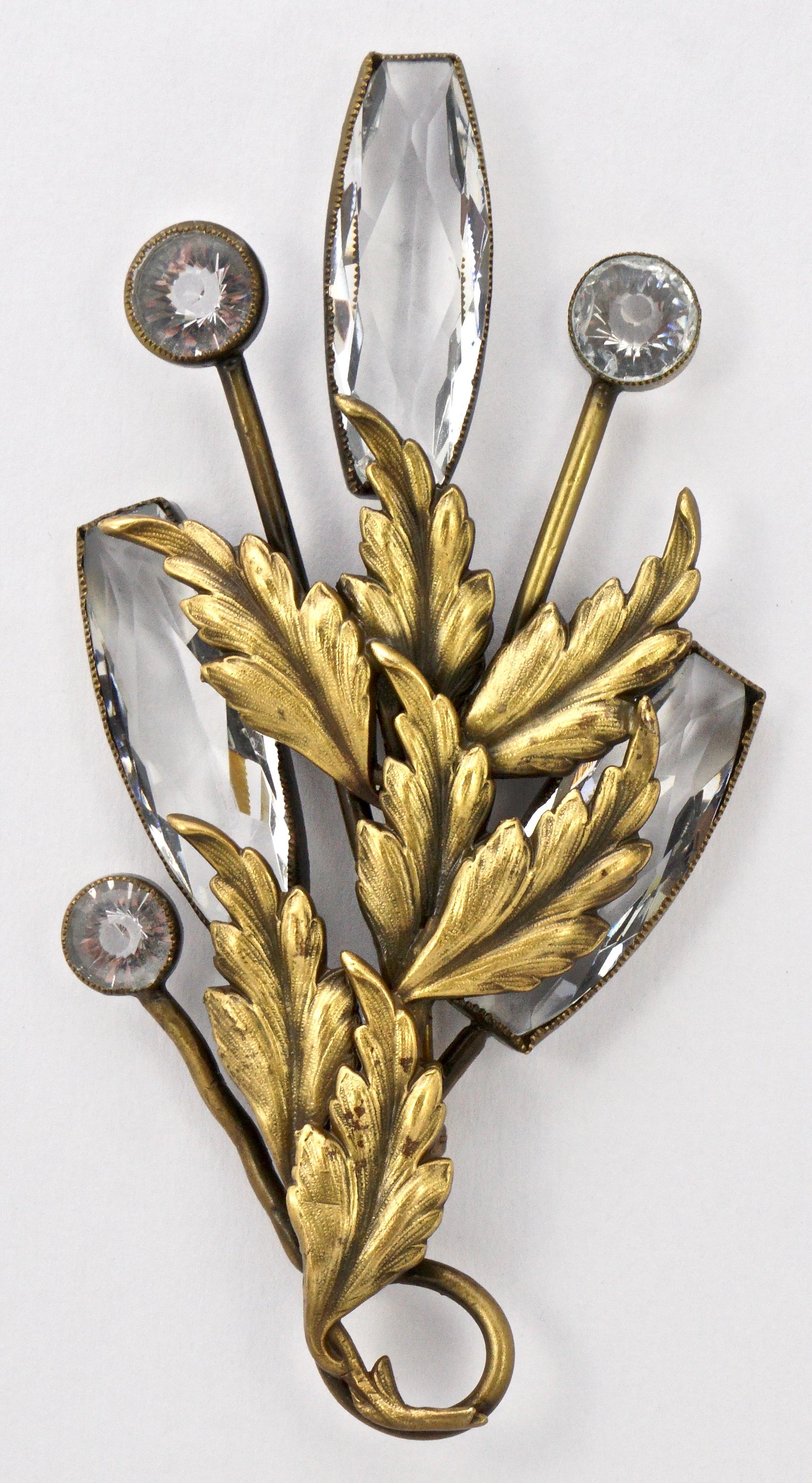 Joseff of Hollywood large brooch and clip-on earrings set. Featuring leaves with the Joseff Russian gold plated antique finish, and brilliant clear crystals. The brooch measures 12cm / 4.7 inches by 6.5cm / 2.5 inches, and the earrings are length