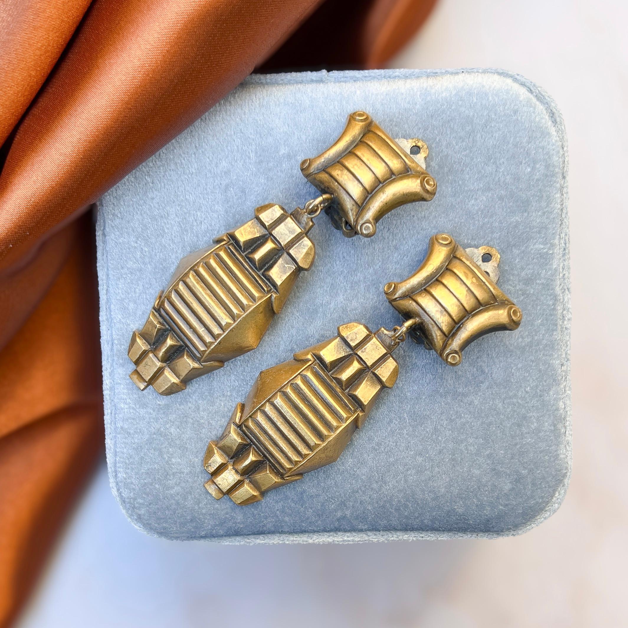 These sophisticated earrings were most likely created in the 1950s. They are  by the renowned costume jeweller, Joseff of Hollywood.

Condition Report:
Excellent

The Details...
These earrings are made from the famous matte gold plate, which Joseff
