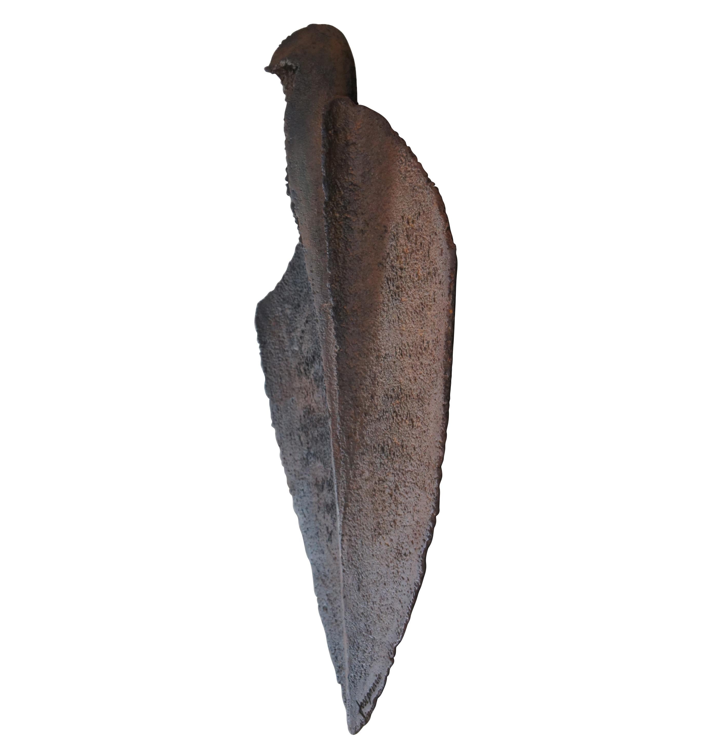 An Impressive Cast Iron wall hanging sculpture by Josep Maria Subirachsb. 1927. Reminiscent in form to an arrowhead or primitive blade. Josep incorporated grattage leaving the surface rough and jagged. Signed along lower edge. Circa 1960s, Measure: