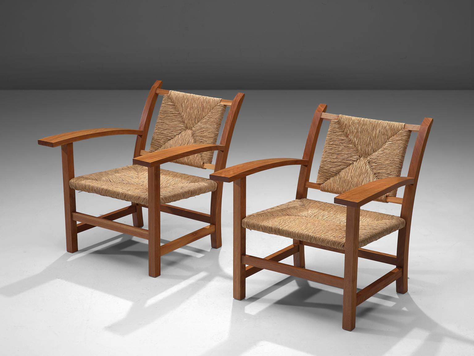 Josep Torres Clave, set of 2 armchairs, oak and cane, Spain, 1950s. 

This set of armchairs by Josep Torres Clave have an oak frame and its seat and back upholstered in woven cane. The design is functionalistic, yet rustic. The armrests are slightly