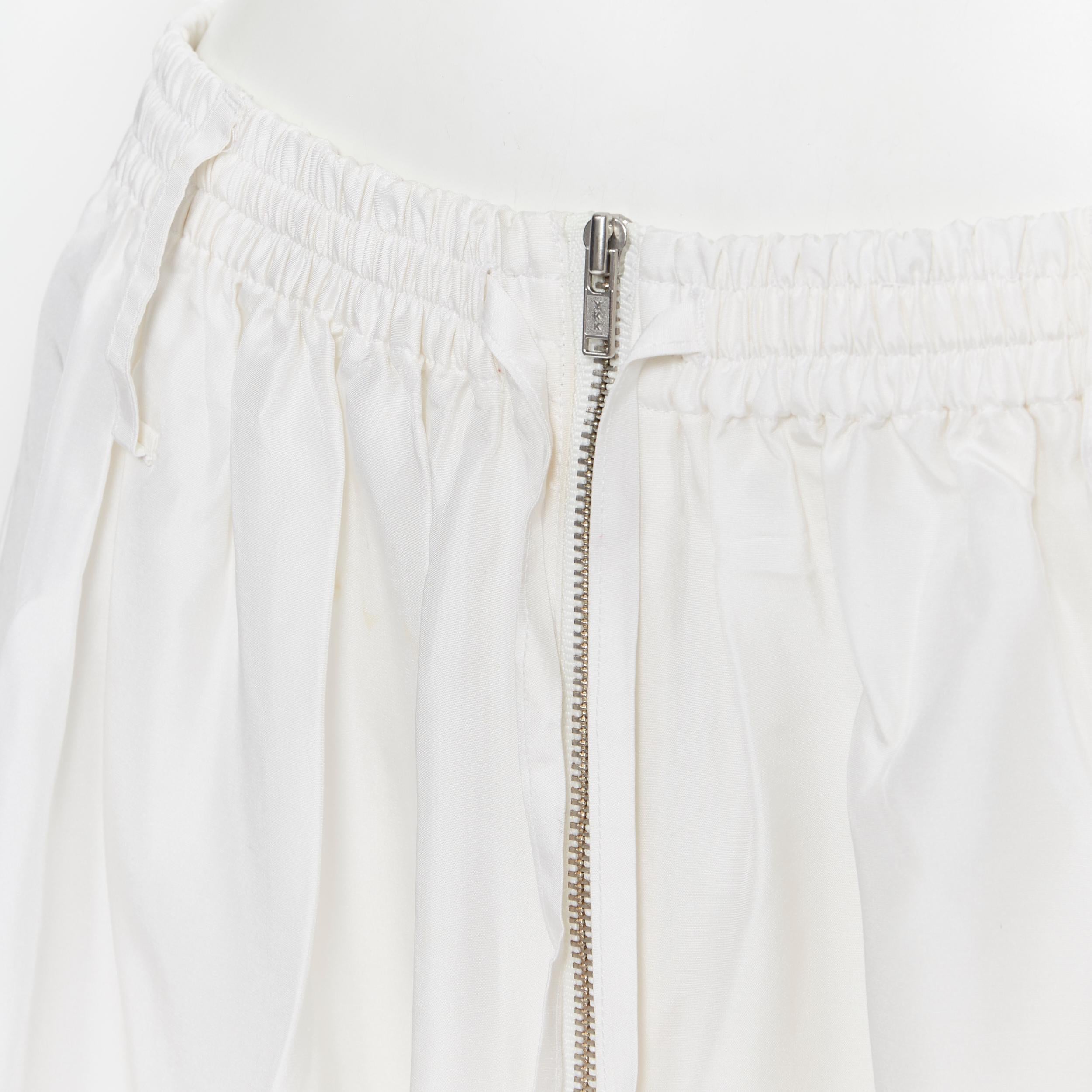 JOSEPH 100% silk ivory white elasticated drawstring zip detail midi skirt FR34
Brand: Joseph
Model Name / Style: Silk skirt
Material: Silk
Color: White
Pattern: Solid
Extra Detail: Stretch waist band. Zip front closure.
Made in: China

CONDITION: