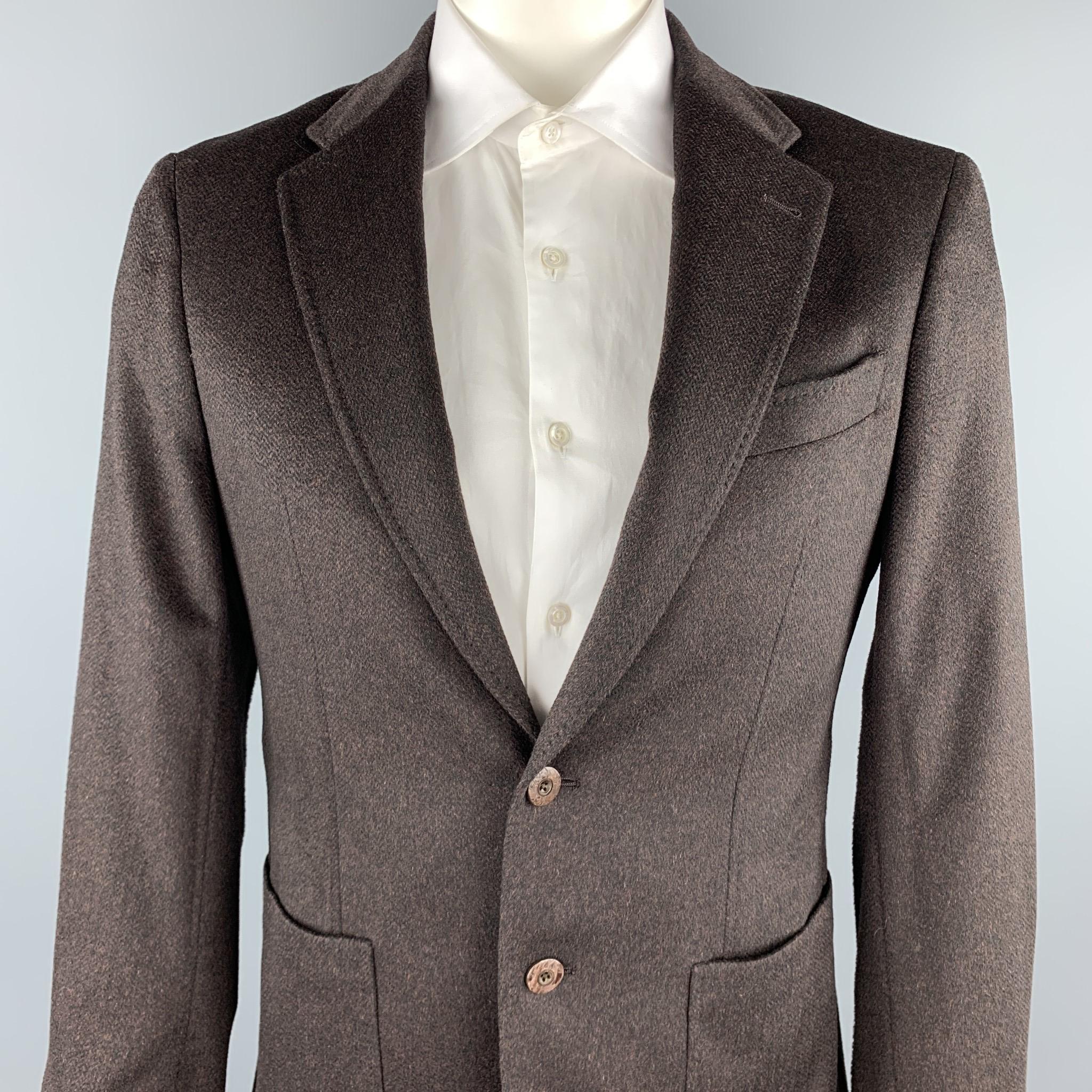 JOSEPH ABBOUD sport coat comes in a brown textured cashmere featuring a notch lapel, patch pockets, shoulder paisley print liner, patch pockets, and a two button closure. Made in USA.

Excellent Pre-Owned Condition.
Marked: 40