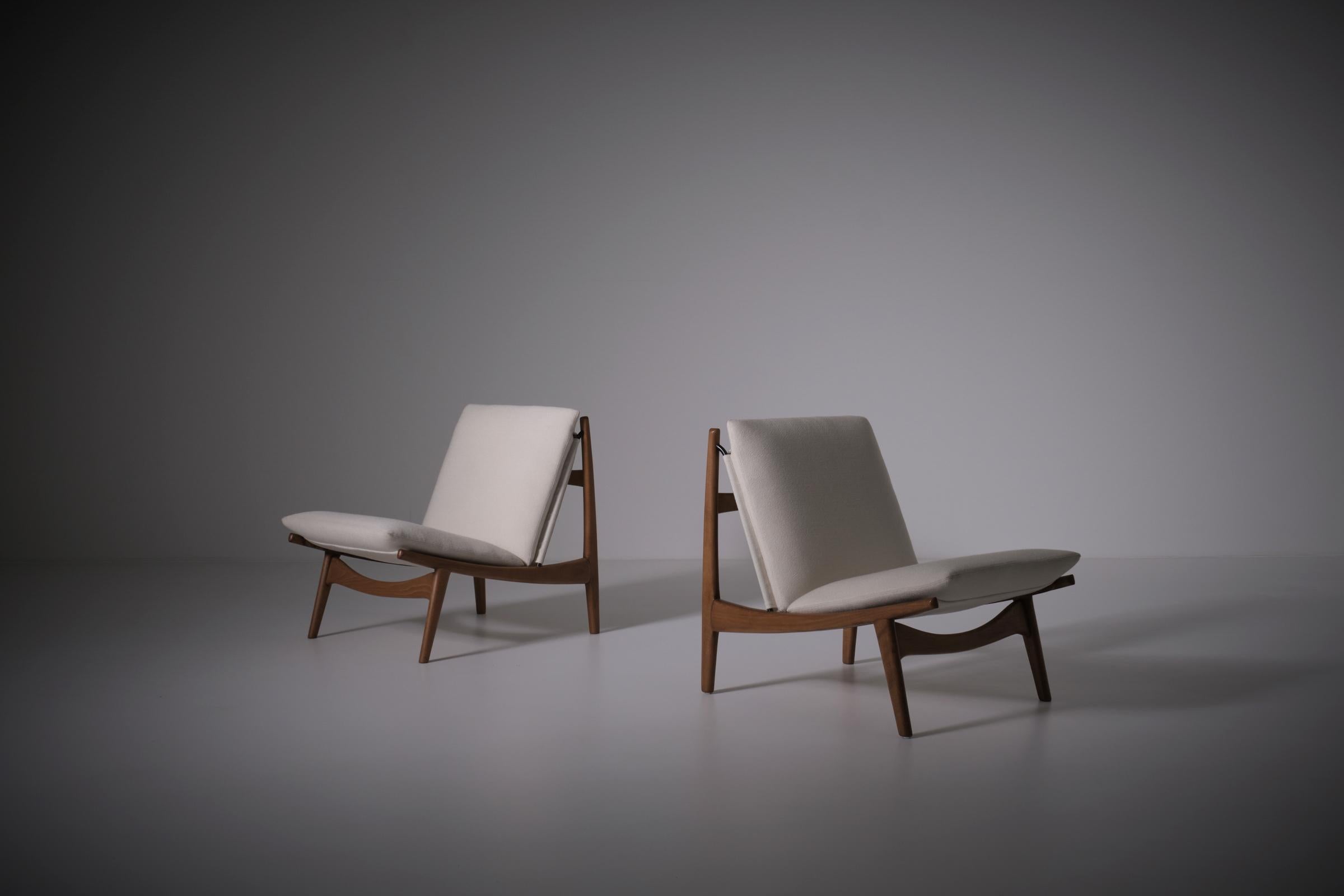 Rare pair of '790' easy chairs by Joseph-André Motte for Steiner, France 1963. The chairs have a remarkable sculptural shaped frame out of stained Ash. The frames are executed with a smart metal tubular support for both the strength and mounting of