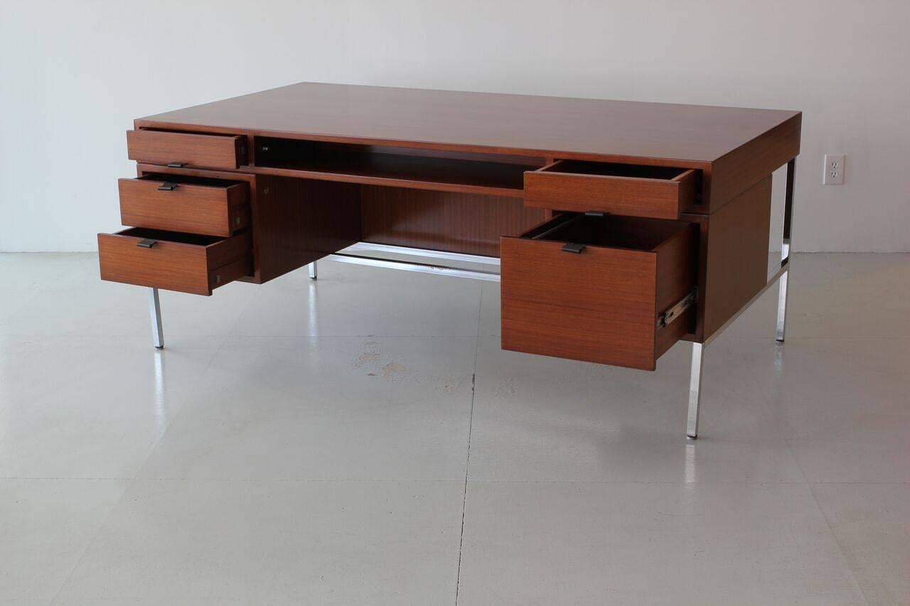 Joseph-Andre´ Motte double-sided presidential desk for Dassas.
Beautifully refinished mahogany with leather pulls and chrome base.
Slight peeling to chrome due to age.