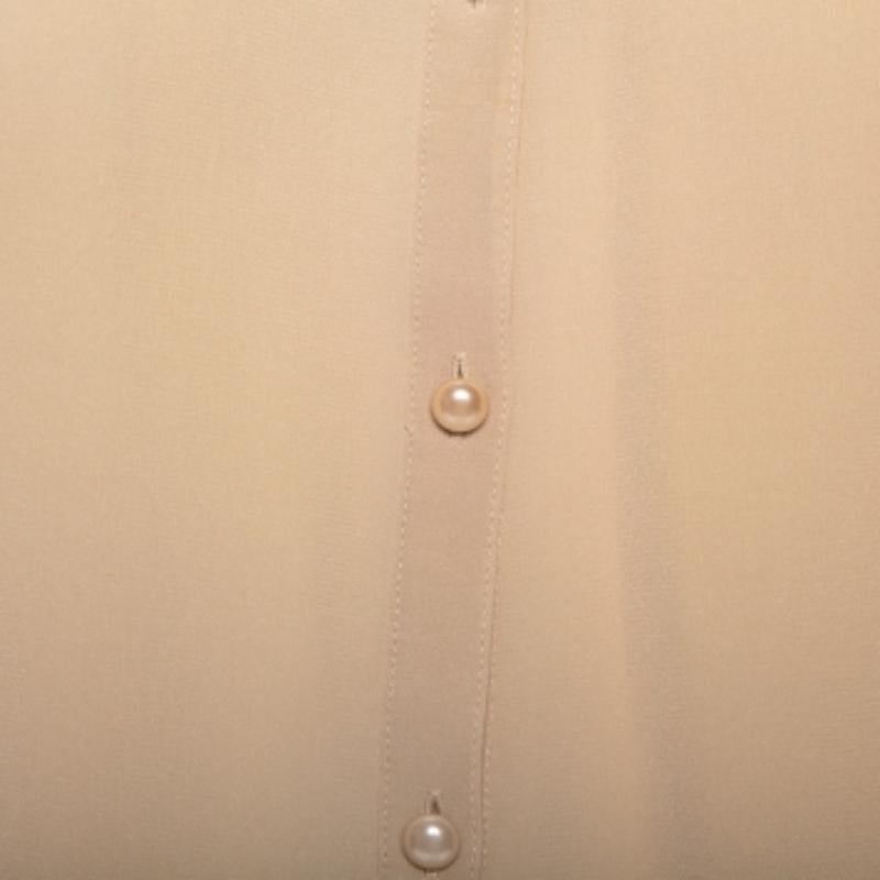 This designer top by Joseph skillfully merges elegant tailoring and minimal detailing with a casual, loose silhouette. The women's silk beige top has a comfortable fit and a design that will look great with both pants and skirts.