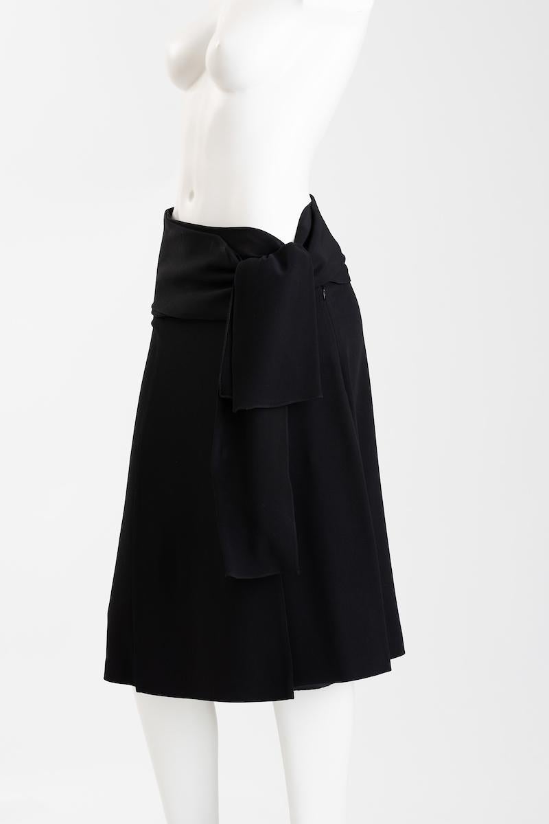 This is a skirt full of delightful surprises. It moves with you.
 Hidden slits and flaps, wrapped belted waist gives a variety of options for styling.
 The long sash belt  allows for a variety of styling. Faux slit pocket on back hip.
The generous