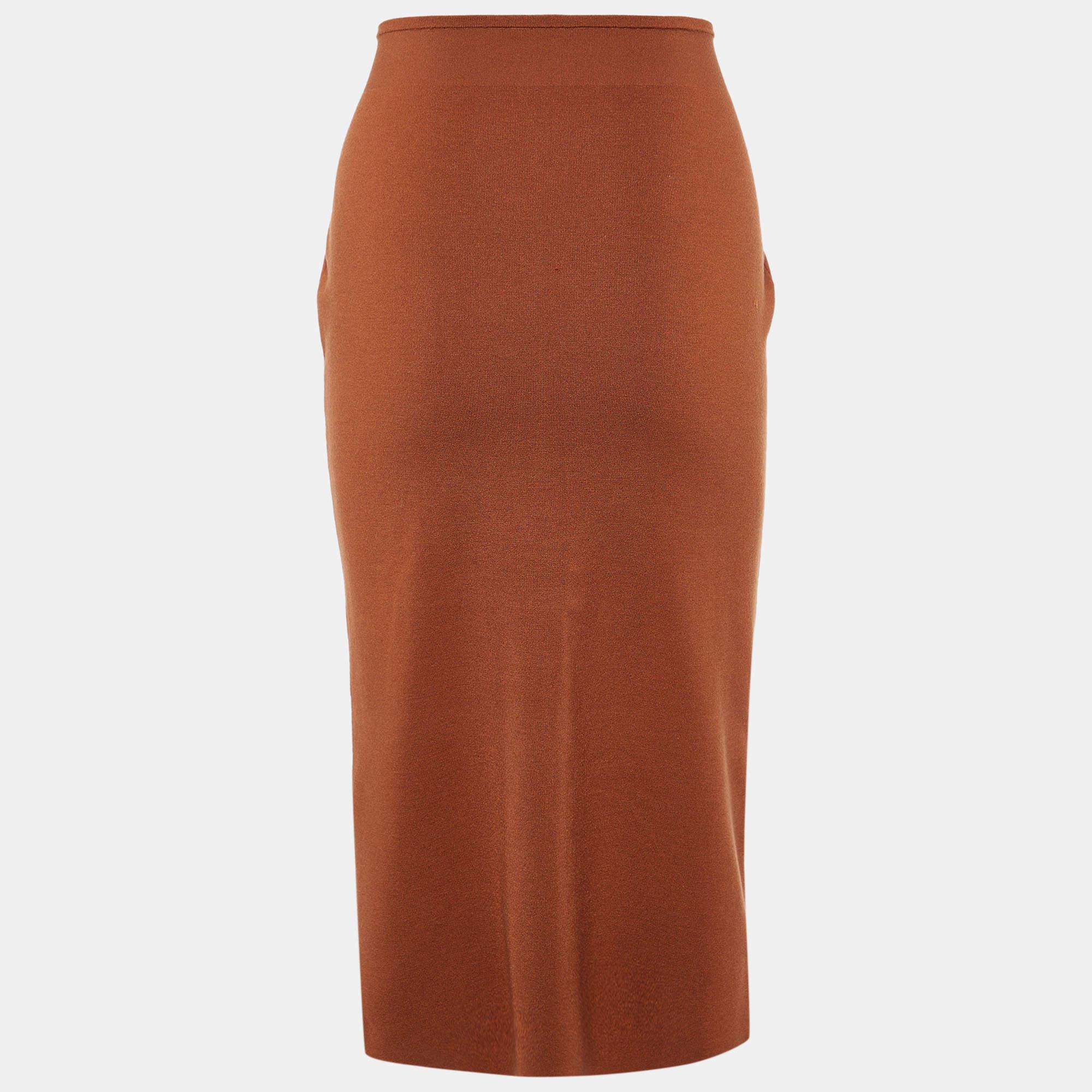 This elegant skirt is worth adding to your closet Crafted from fine materials it is exquisitely designed into a flattering shape.