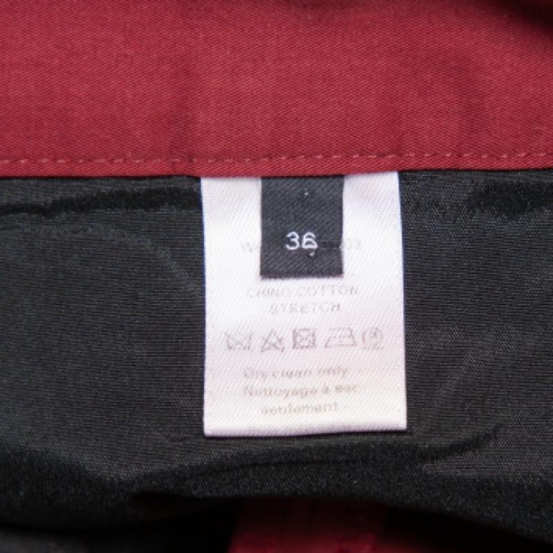 Look your fashionable best by owning these chino pants from Joseph. The burgundy pants are made of cotton and flaunt pockets and front fastening. Slightly fold the hem and wear them with flats or with sneakers.