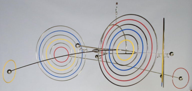 Midcentury Kinetic mobile sculpture by Joseph Burlini made of chrome and painted metal. Three rods suspends on a dome shaped hanger with each rod measuring 48