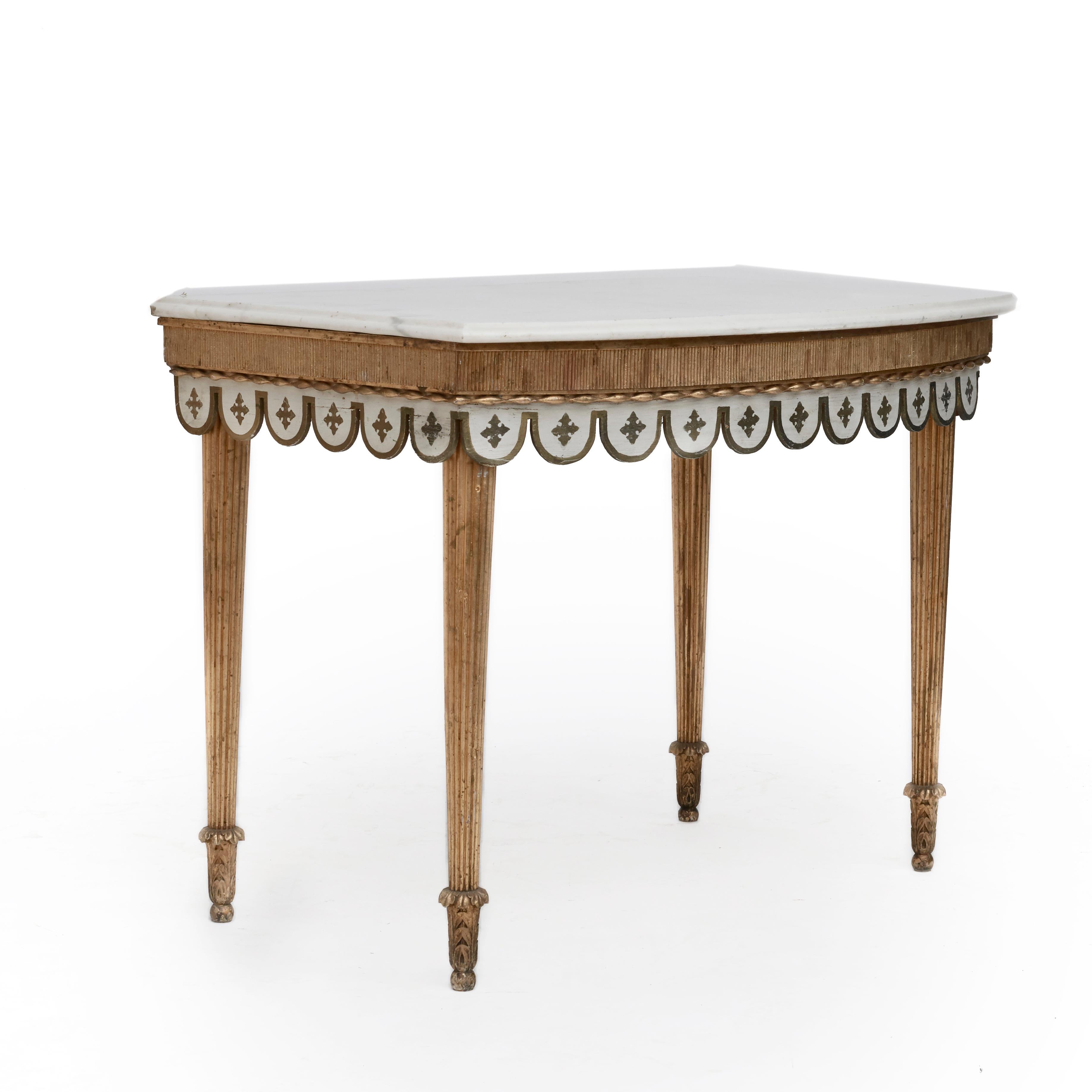 Joseph Chr. Lillie 1760-1827.
Louis XVI giltwood console table with beautiful white marble top with profiled edge. Legs and friezes in gilded wood with grooves.
Scalloped edge apron with gilded fleur-de-lis decorations. Legs ending in acanthus