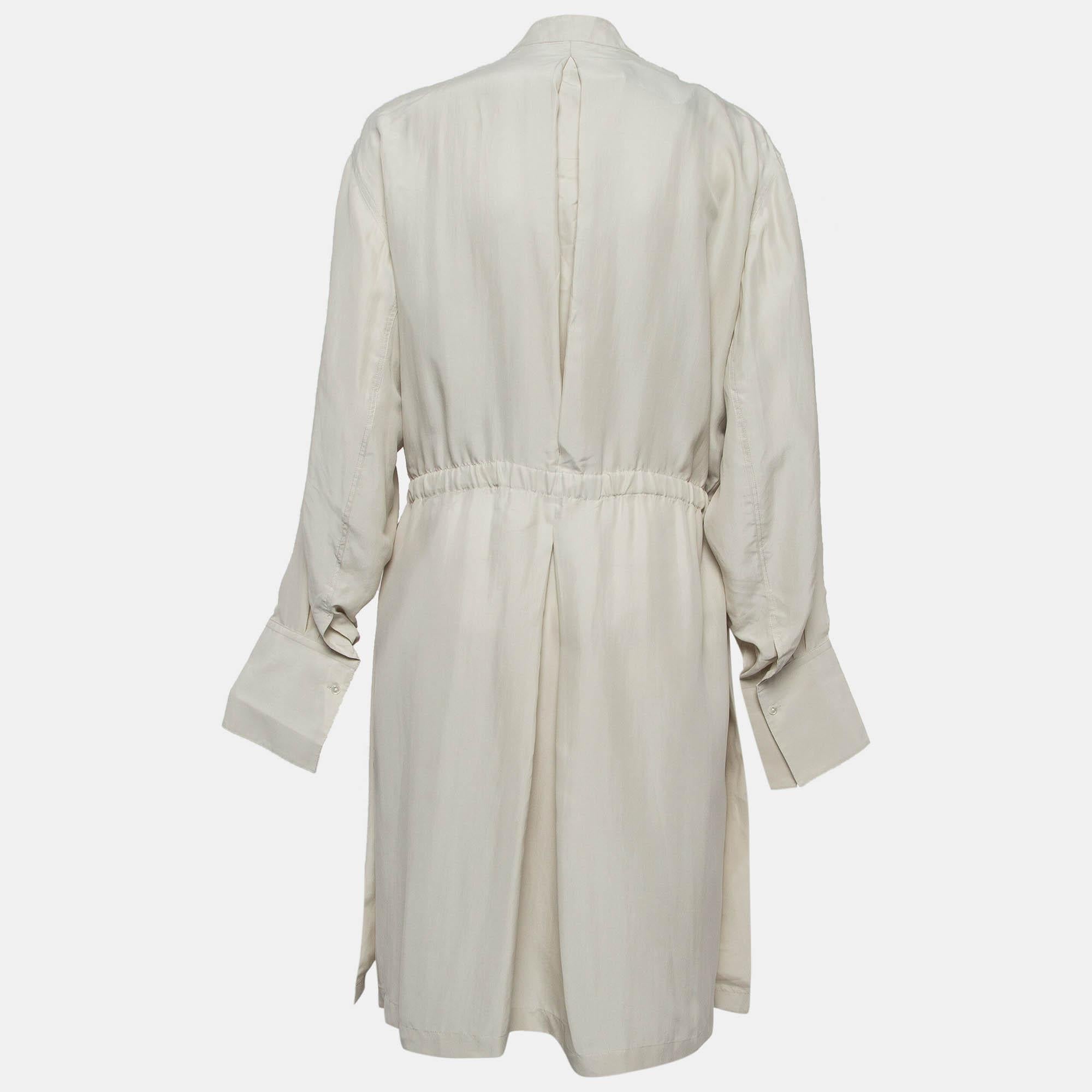 Exhibit a stylish look by wearing this beautiful designer dress. Tailored using fine fabric this dress has a chic silhouette for a framing fit. Style the creation with chic accessories and pumps.