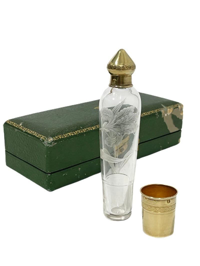 Joseph crossard French silver gold plated and Engraved traveling liqueur Bottle, 1900.

A French Art Nouveau crystal bottle, richly decorated with gold plated finish. Consisting of a lid with round knob, collar and removable cup that encases the