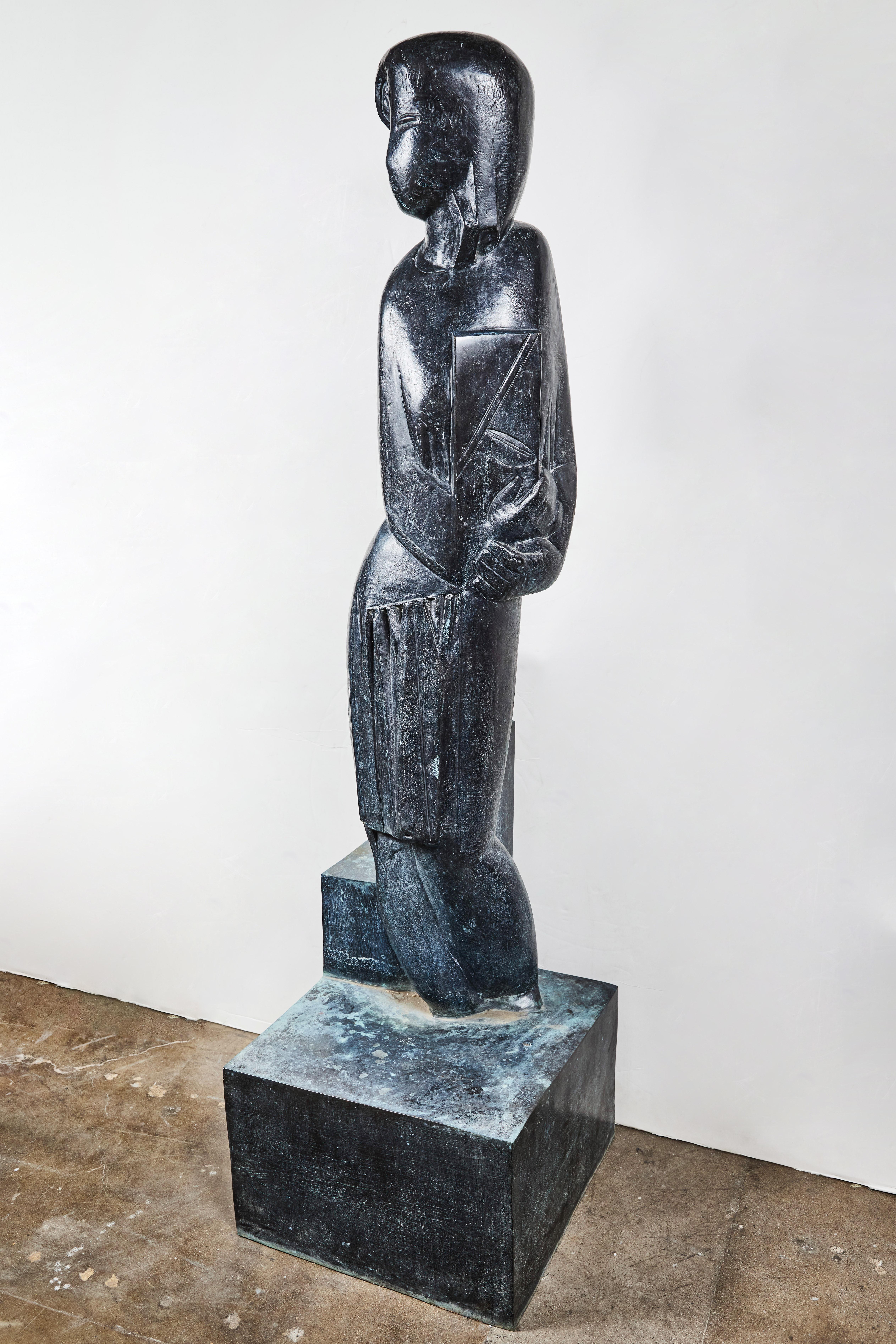 A chic, signed and dated, 1928, cubist style cast bronze sculpture, 