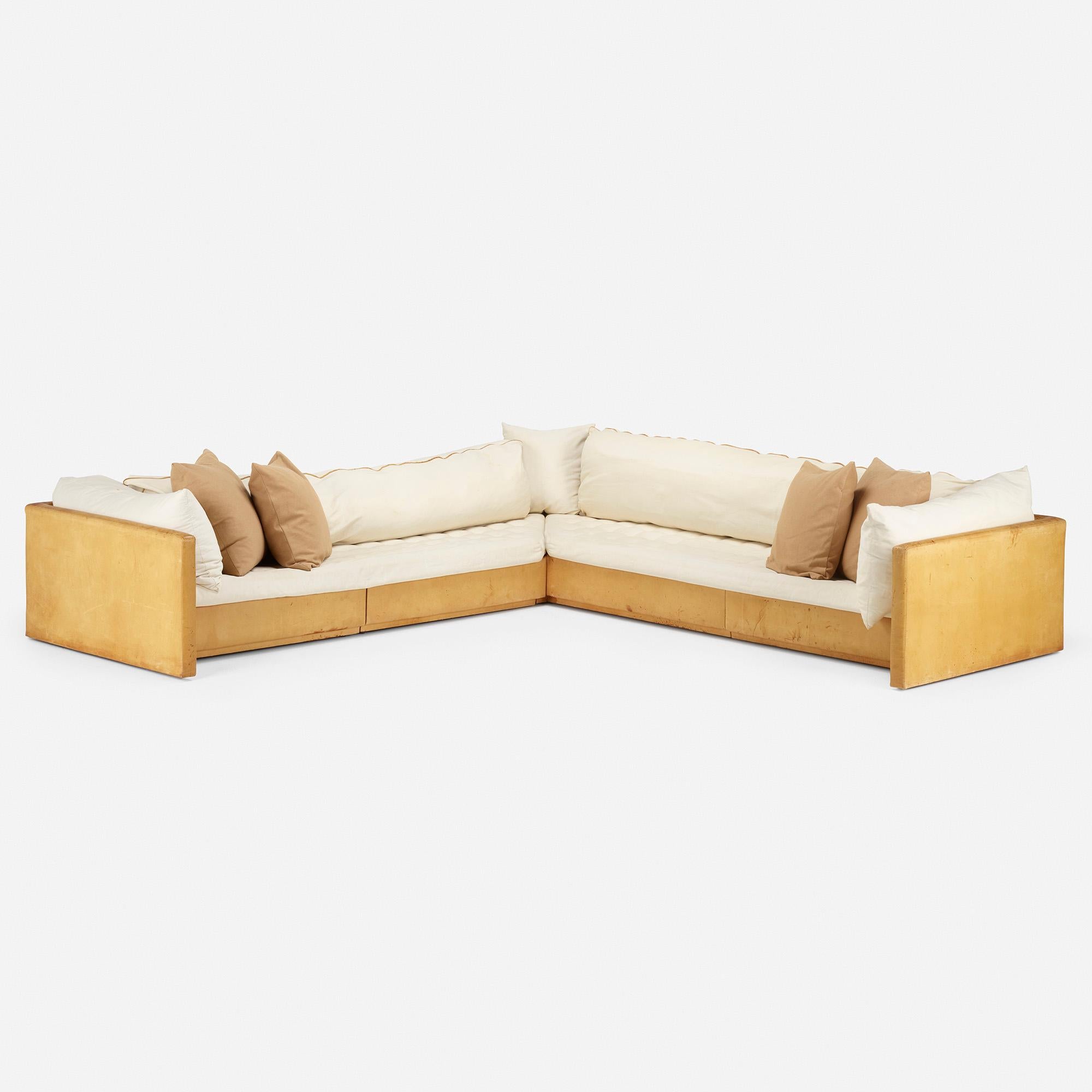 Made by: Knoll, USA, circa 1985

Material: leather, canvas upholstery

Size: 133 W × 133 D × 25 H in seat height 14 inches

Description: 'This D'Urso Sofa for Knoll is a custom example specified by designer Joe D'Urso for an interior design