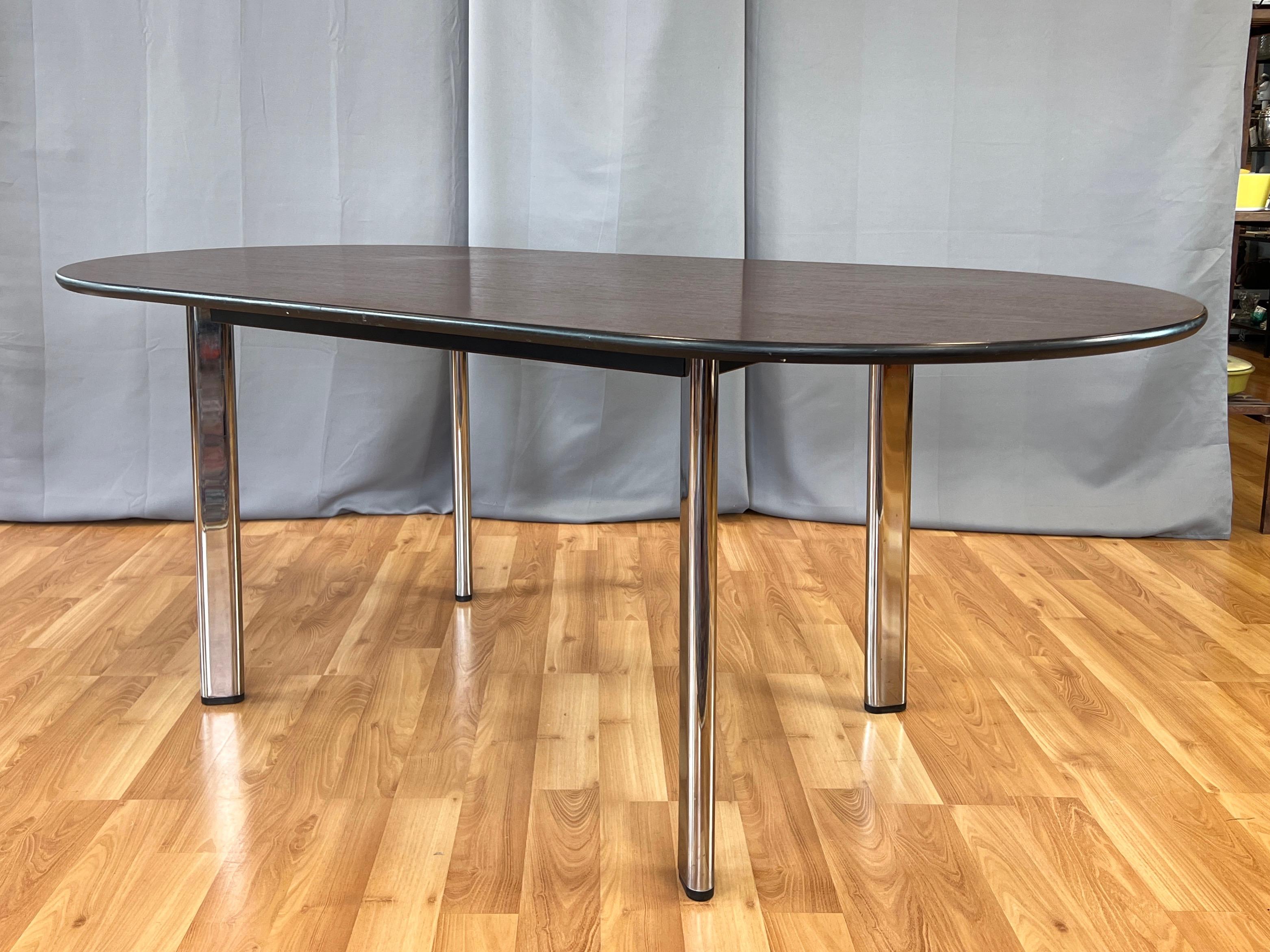 A 1995 production of designer Joe D’Urso’s minimalist 1980 High Table for Knoll with American cherry racetrack top and chrome legs.

Top features a handsome expanse of richly-hued and finely-grained American cherry veneer—darker in person than in
