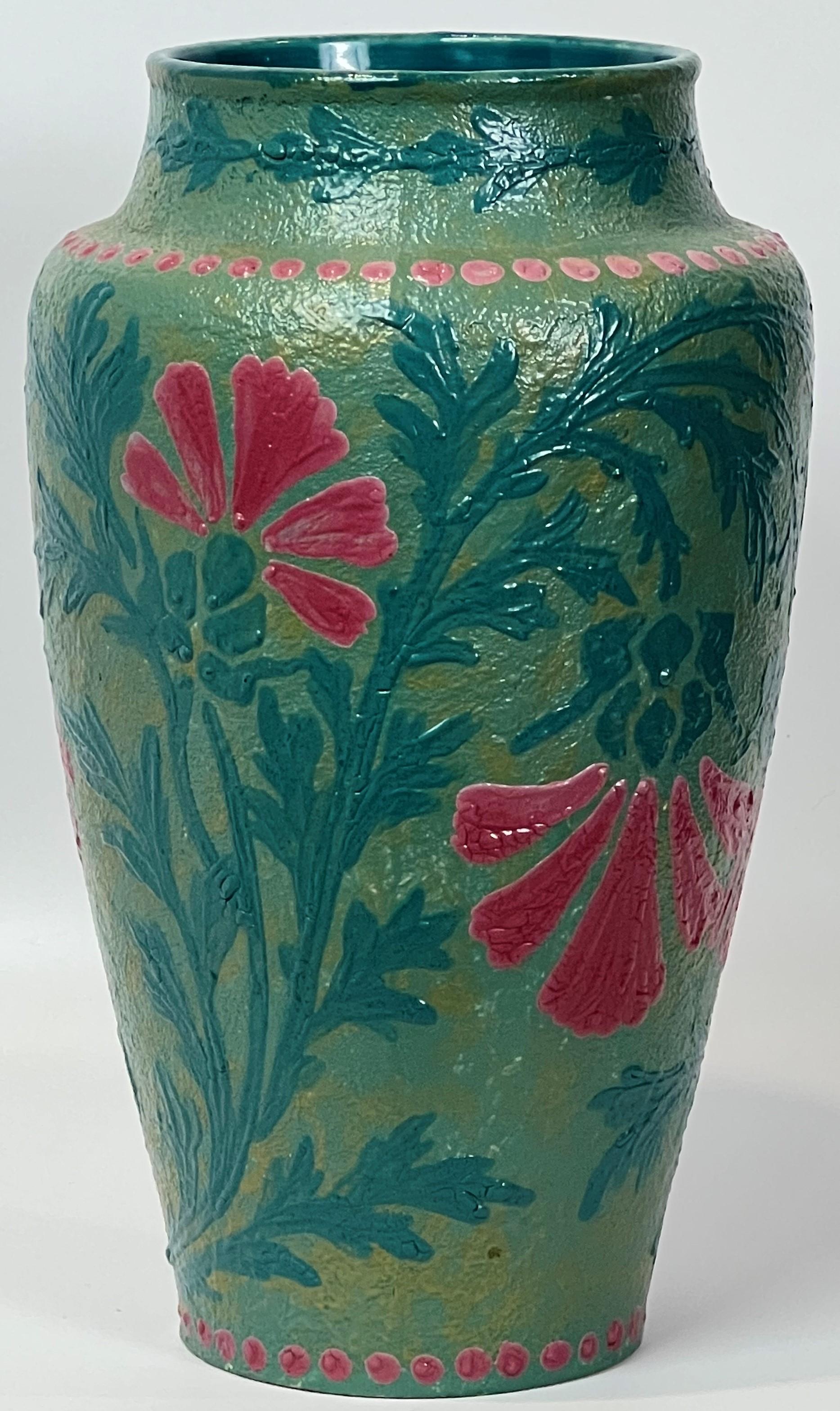 In 1908 Joseph Ekberg became the lead artist and decorator at Gustavsberg in Sweden. This vase is likely one of the examples he executed in preparation for an exhibition in Germany in 1909. The painted conventionalized flowers are in the Jugendstil