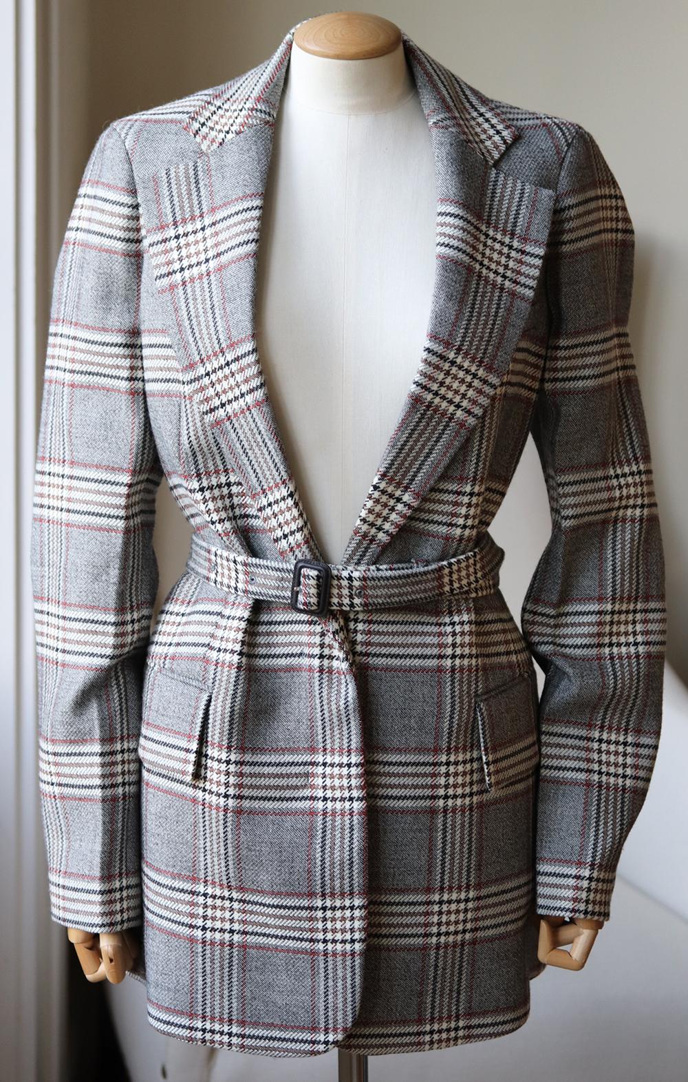 Joseph's classic blazer is patterned with heritage-inspired checks, has oversized pockets and is tailored in cozy wool.
This jacket features a partially concealed, adjustable belt that cinches you in on one side.
Multicoloured wool.
Button