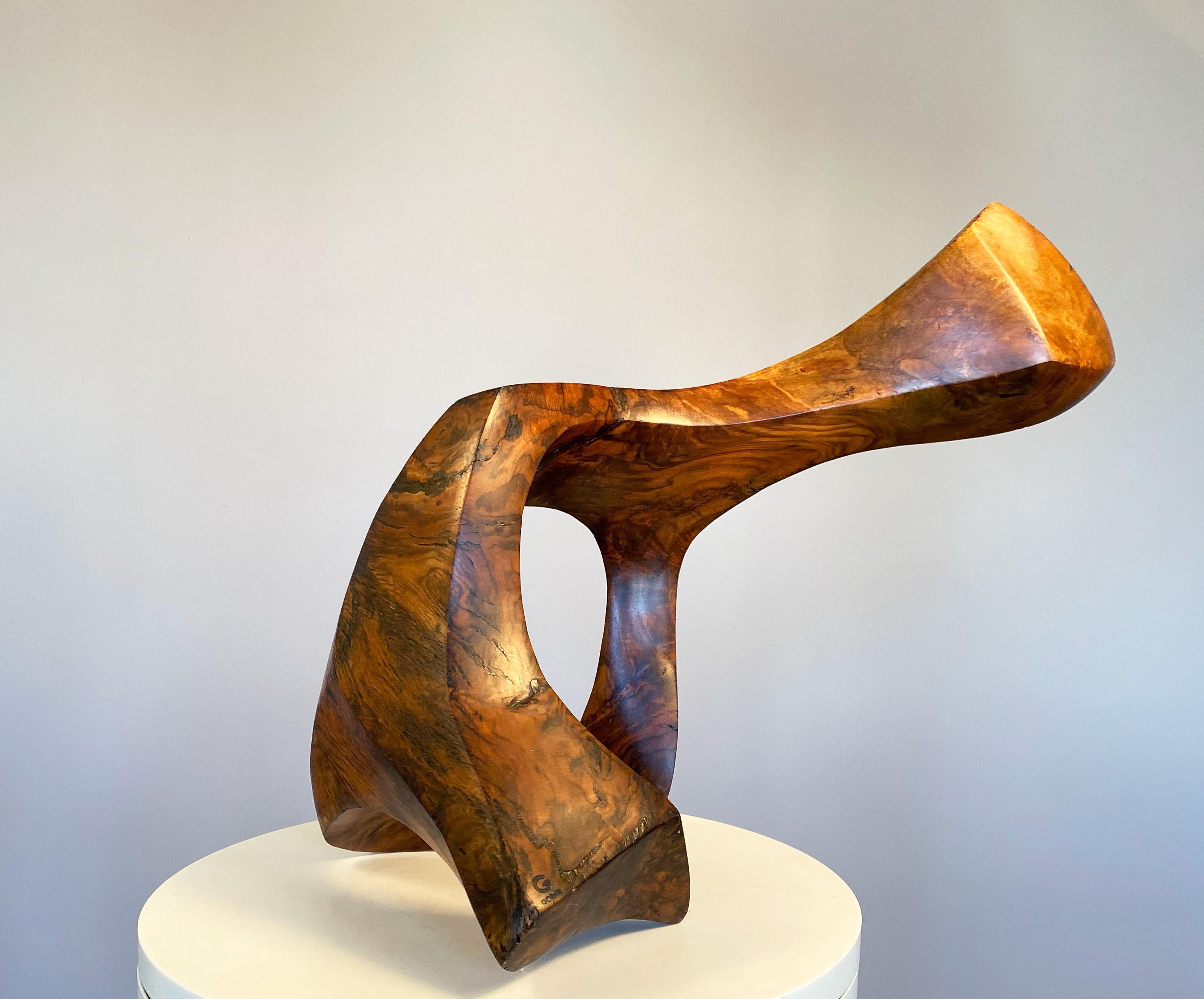 Joseph Goethe was one of America's modernist sculptors who explored carving in wood.  He had a passion for exotic woods and fashioned his subjects according to how the piece of wood inspired him.  This piece is fairly large scale and can sit on a