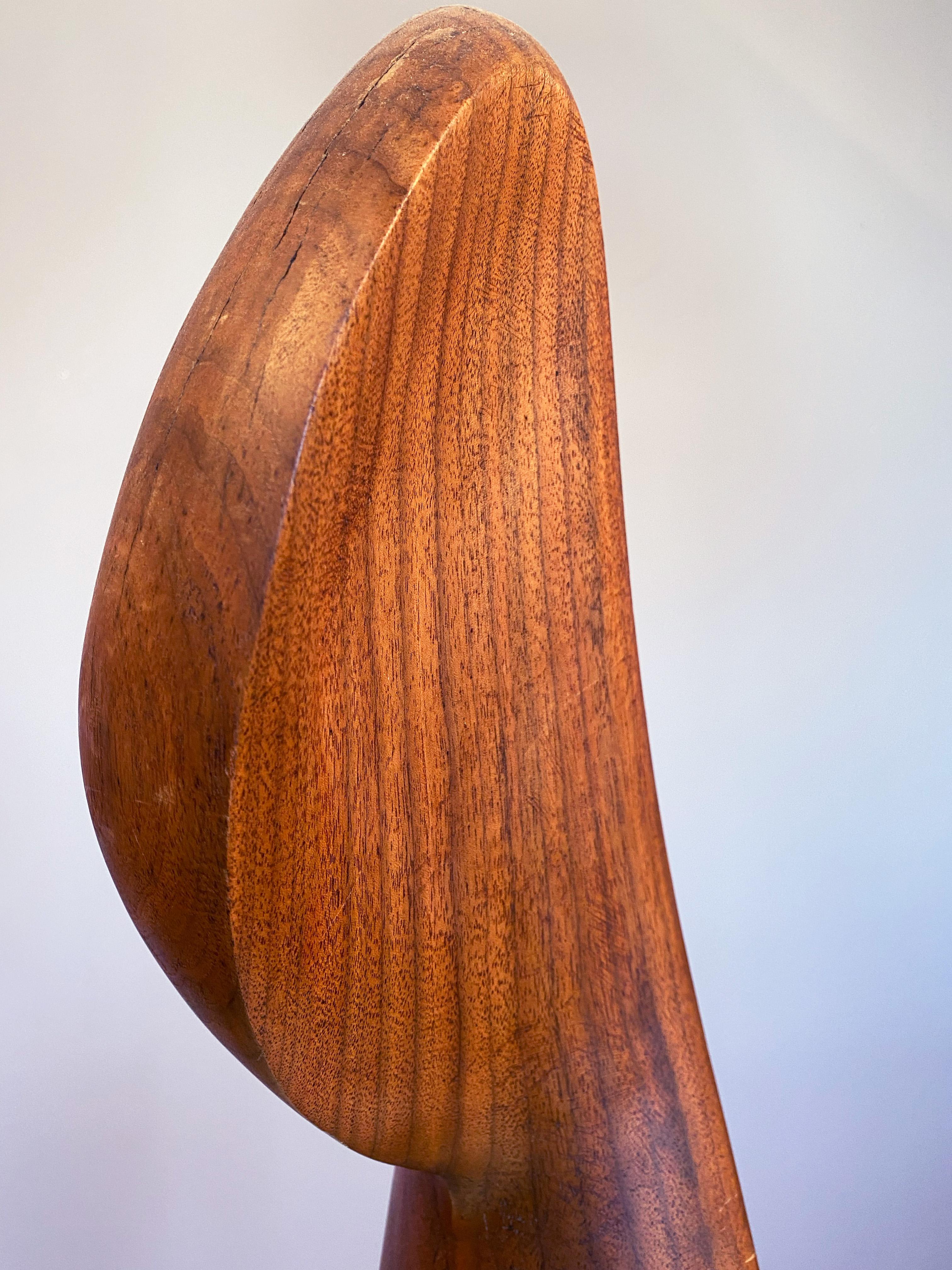 Joseph Goethe was one of America's finest early modernist carvers in wood.  He experimented with exotic woods often collected in his native California and from other countries.  This form is a non-objective work yet Goethe referred to it as a 