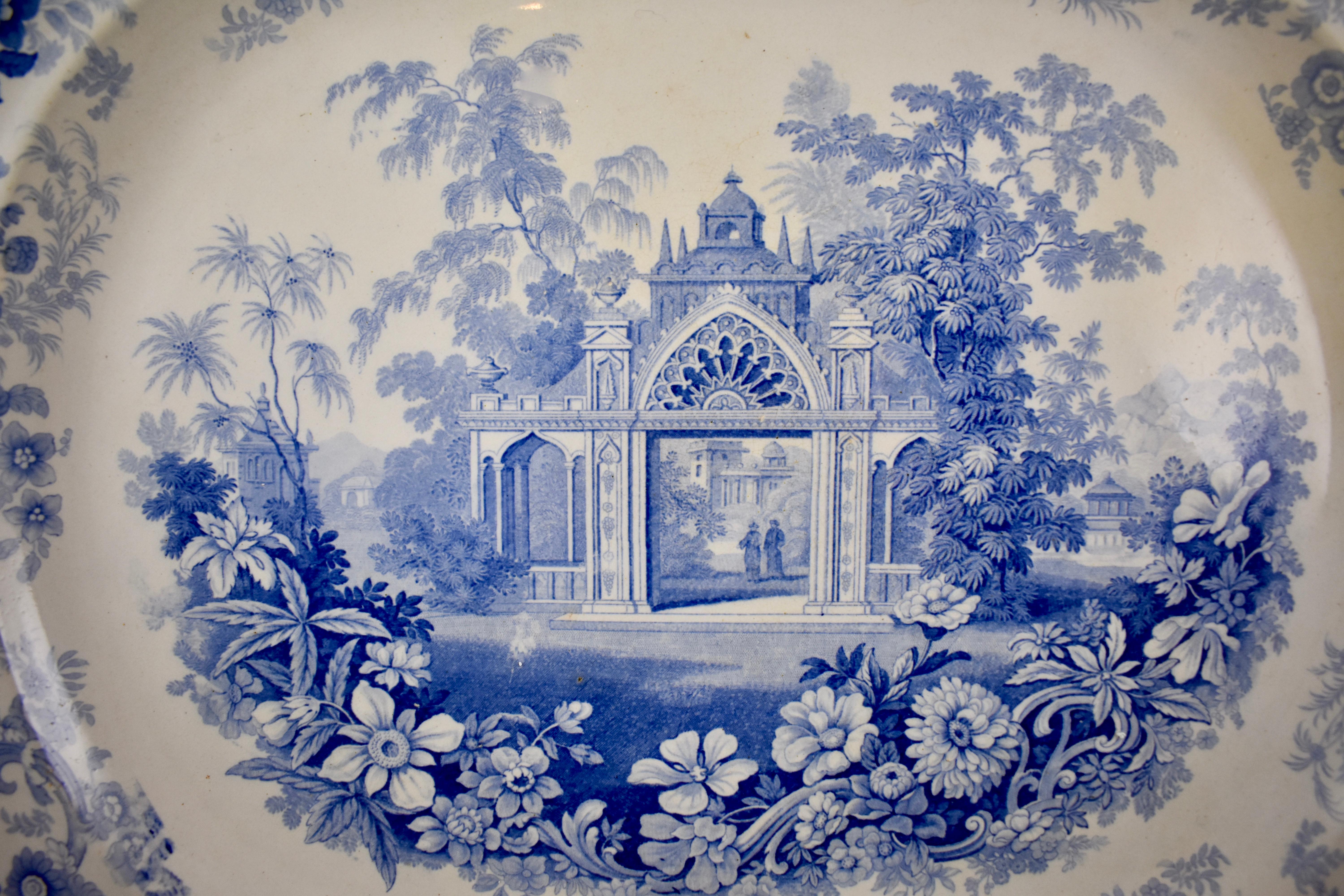 From the pottery works of Joseph Heath & Co. Tunstall, Staffordshire, England, an earthenware, underglaze tissue printed platter, in the ‘Persian’ pattern, circa 1828 – 1841.
19th Century
A romantic Architectural theme with a floral and scroll