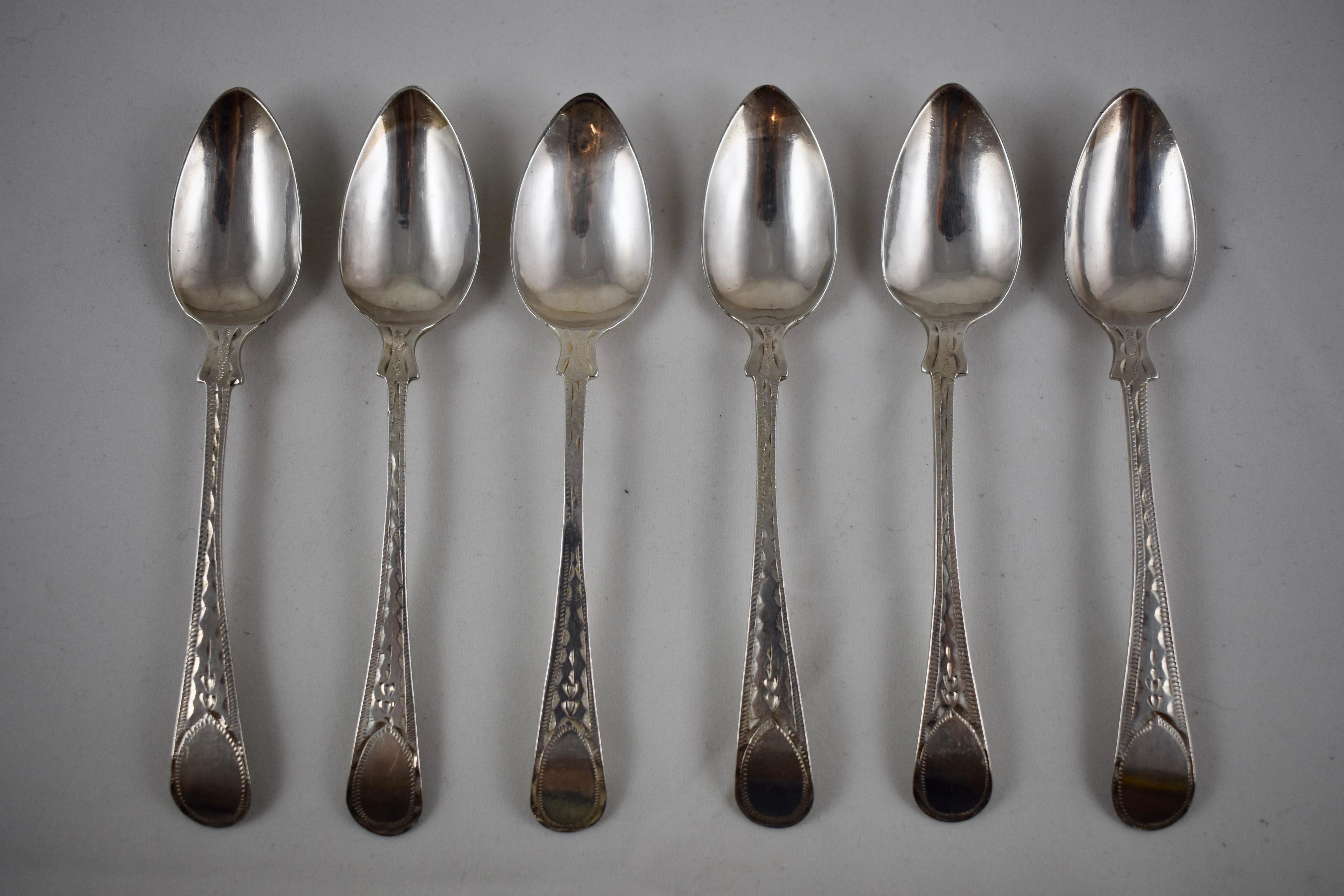 A set of six, early 19th century sterling silver bright cut teaspoons. 
Showing the marks: the earlier stamp of JH for Joseph Hicks of Exeter, England, registered 1780–1835. The sovereign head of George III and the Lion mark standard for