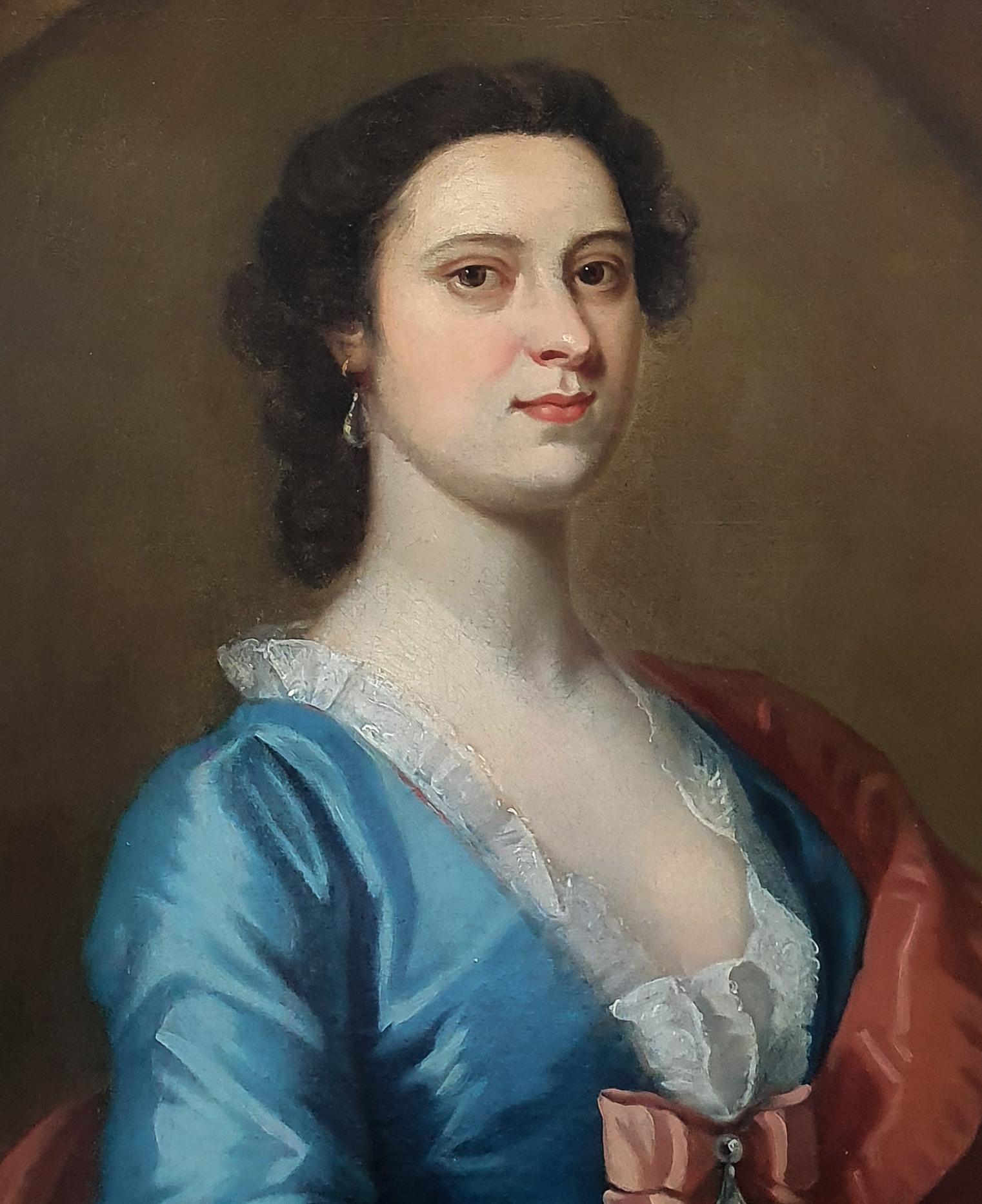This picture was painted in England around 1740 and can be dated according to the hairstyle, the wide billowing sleeves with lace sleeve ruffles, the low neckline, and the large bow at the centre of the chest – this was extremely fashionable.  The