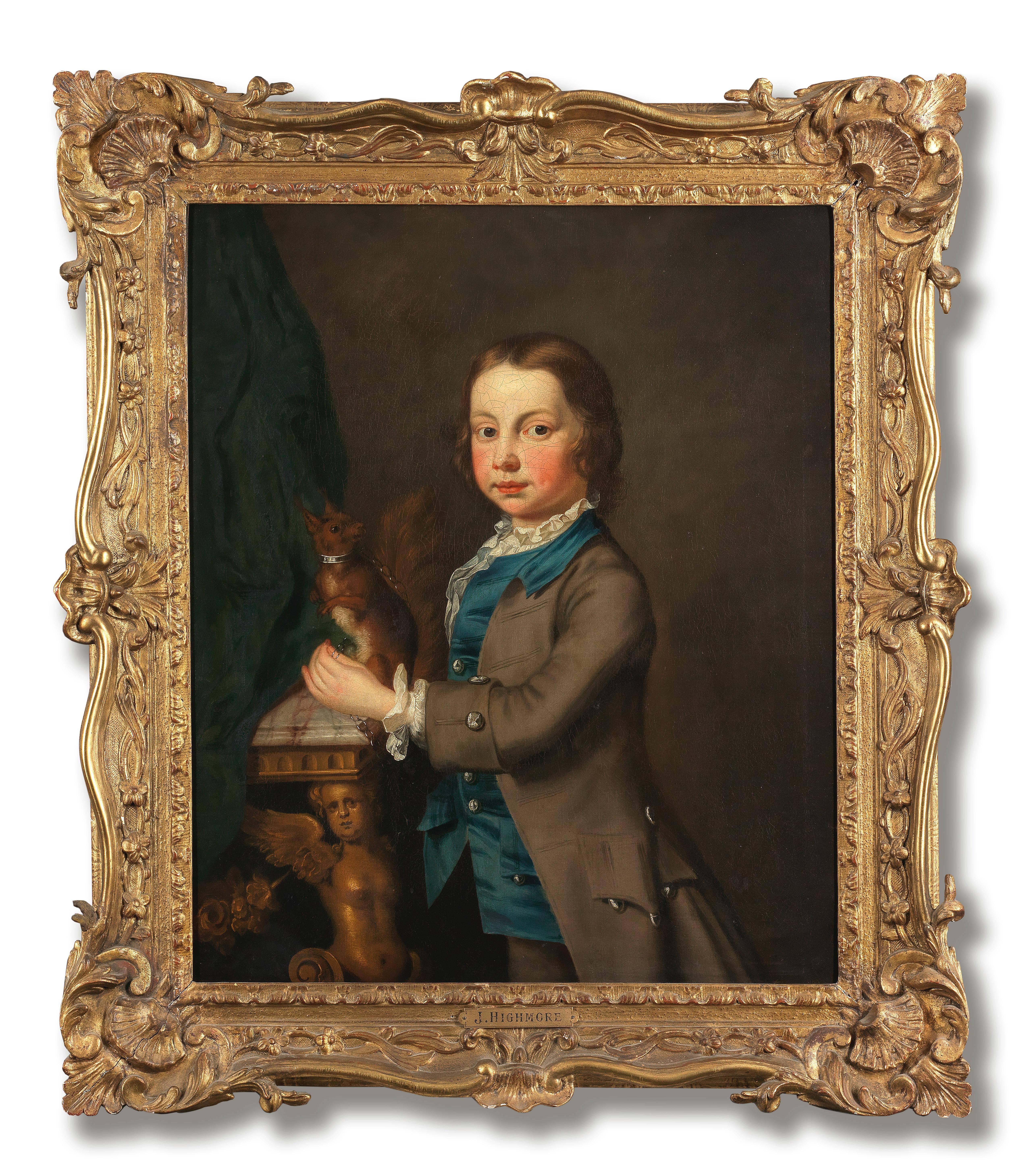 Portrait of a young boy holding his pet squirrel