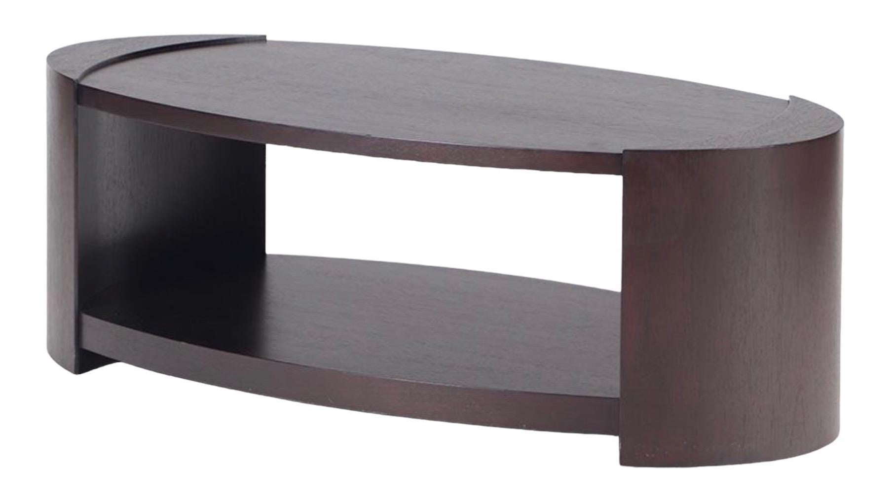 Contemporary oval mahogany coffee table by Joseph Jeup with very clean lines and great proportion. Very solid and high-quality wood. 


