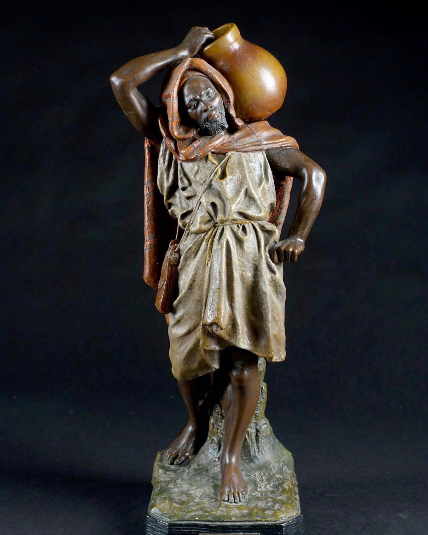 Joseph Le Guluche Figurative Sculpture - Porteur D'eau by Joseph Guluche