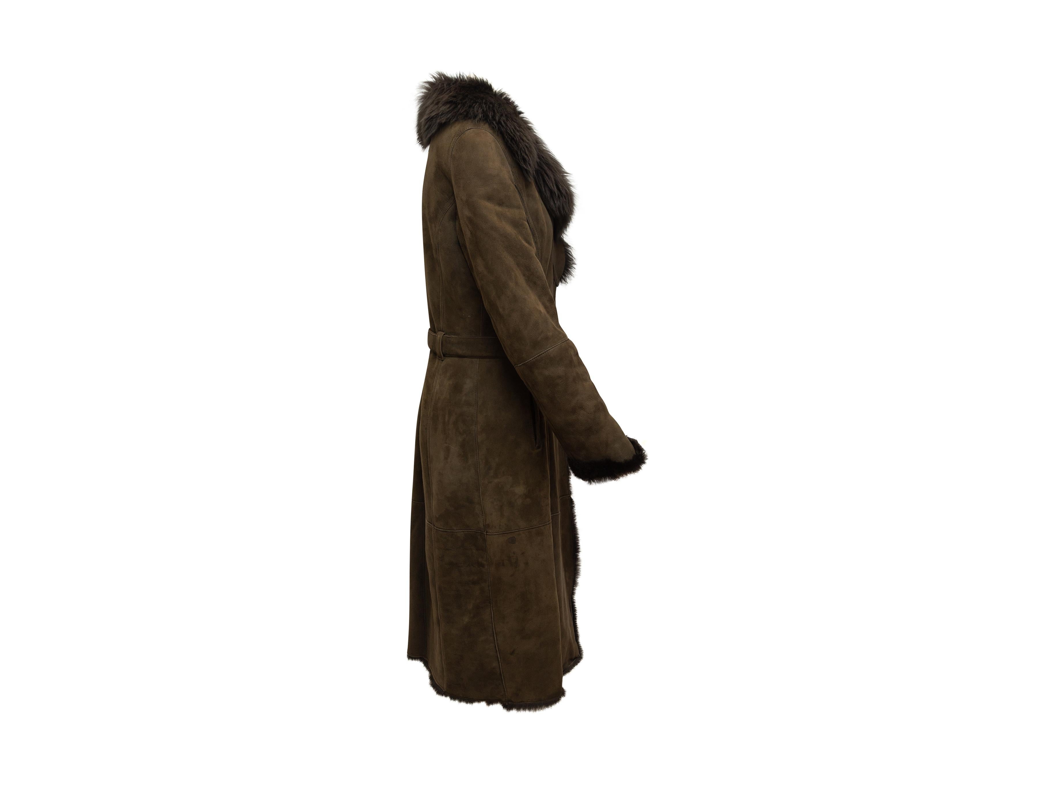 Product details: Brown long shearling coat by Joseph. Notched collar. Dual hip pockets. Belt at waist. 37