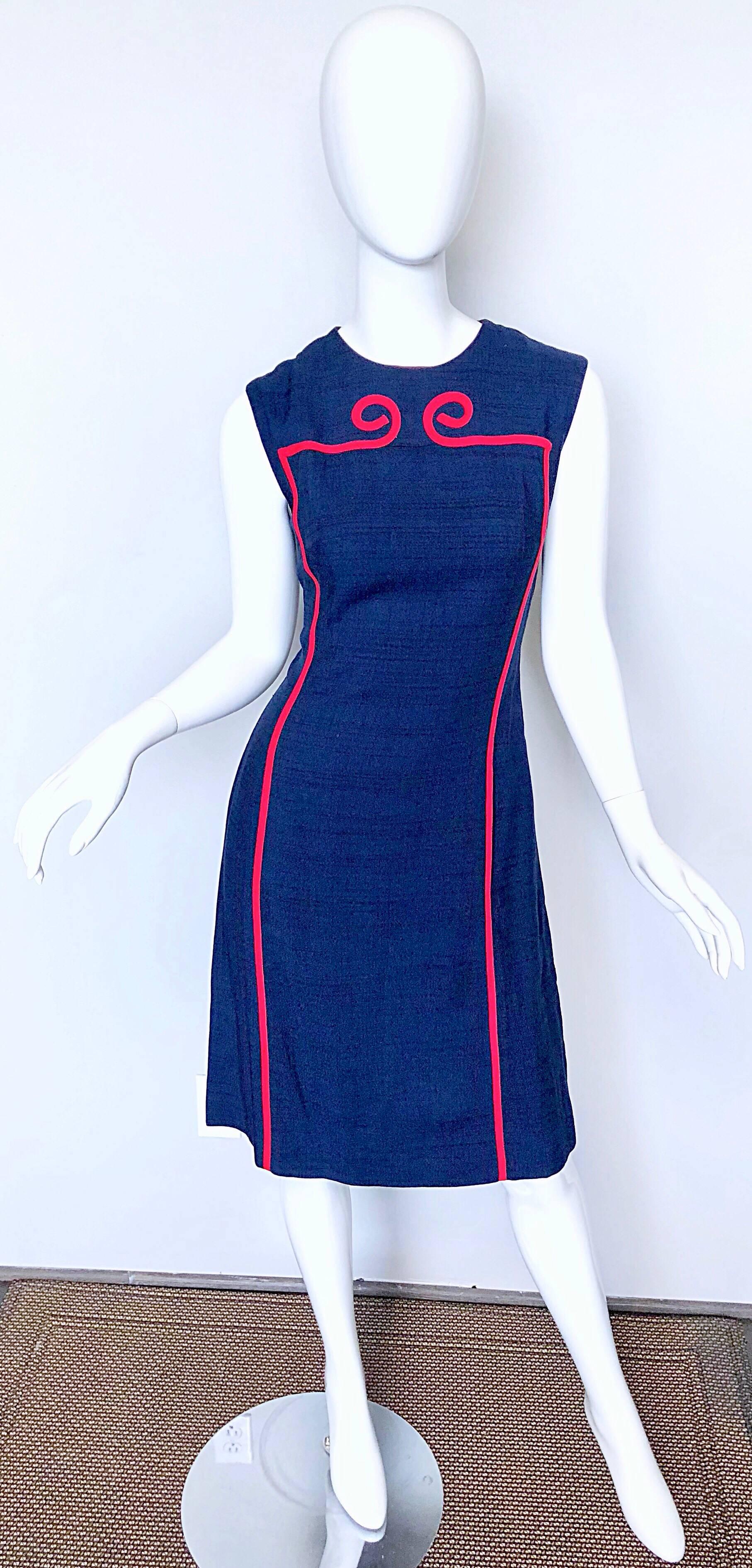 Chic 1960s JOSEPH MAGNIN navy blue and red linen and silk blend nautical shift dress! A dead ringer for Norman Norell, Pierre Cardin, or Louis Feraud. 
Features a regal Roman like scroll red trim. Tailored bodice with a flattering shift skirt.