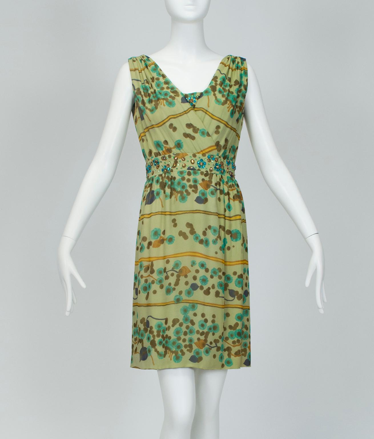 Despite its whisper weight chiffon, this eye-catching shift packs a wallop thanks to a shower of green gemstones and a modern green watercolor print. Perfect for warm spring and summer days when polish is a priority.

Sleeveless surplice bodice