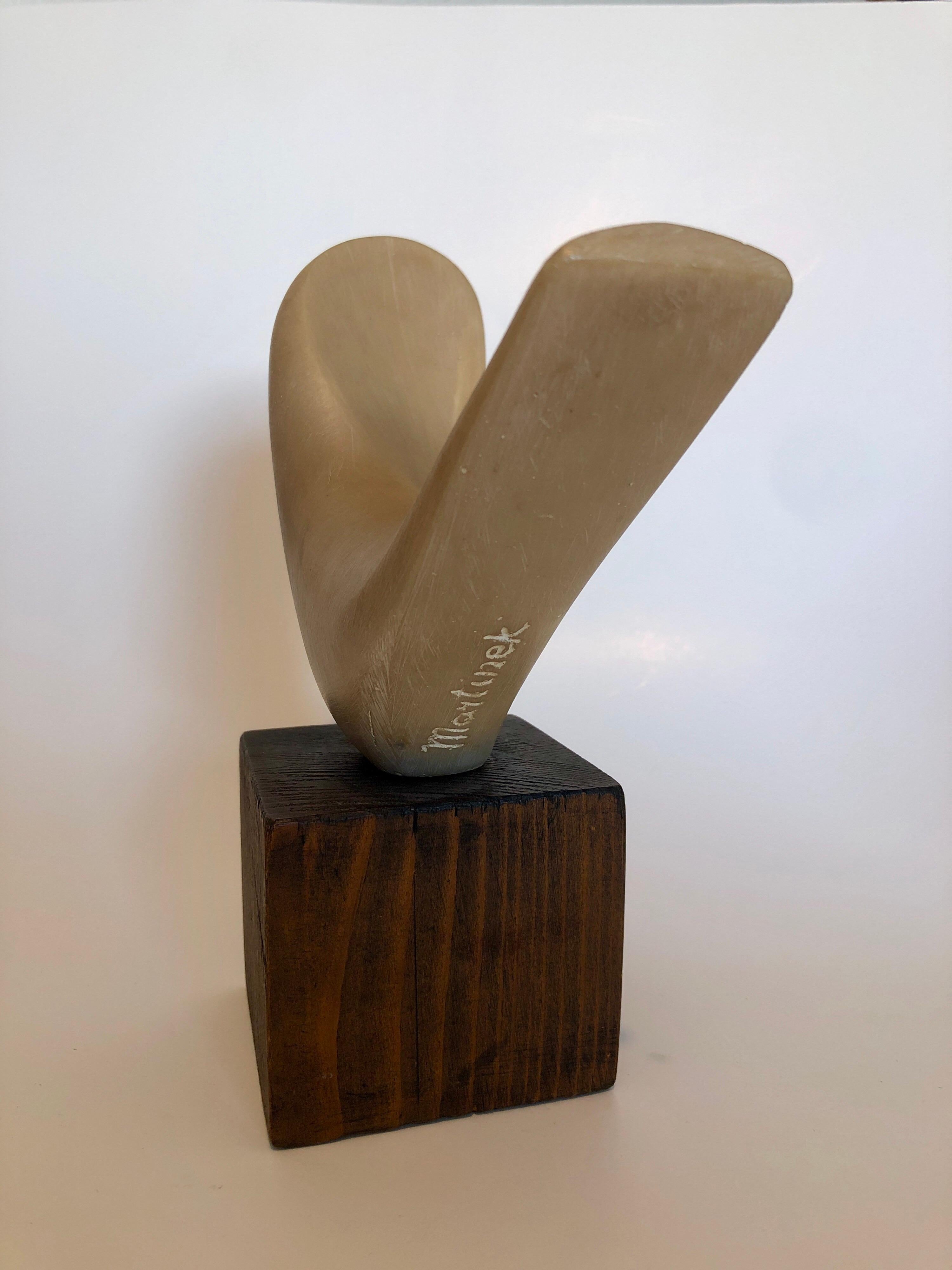 American sculptor Joseph Martinek was born in Chicago in 1915. He was a second generation apprentice to Auguste Rodin. He studied sculpture at the State Industrial School of Art, Prague, Czechoslovakia, 1934-39. 
This abstracted form conceived by