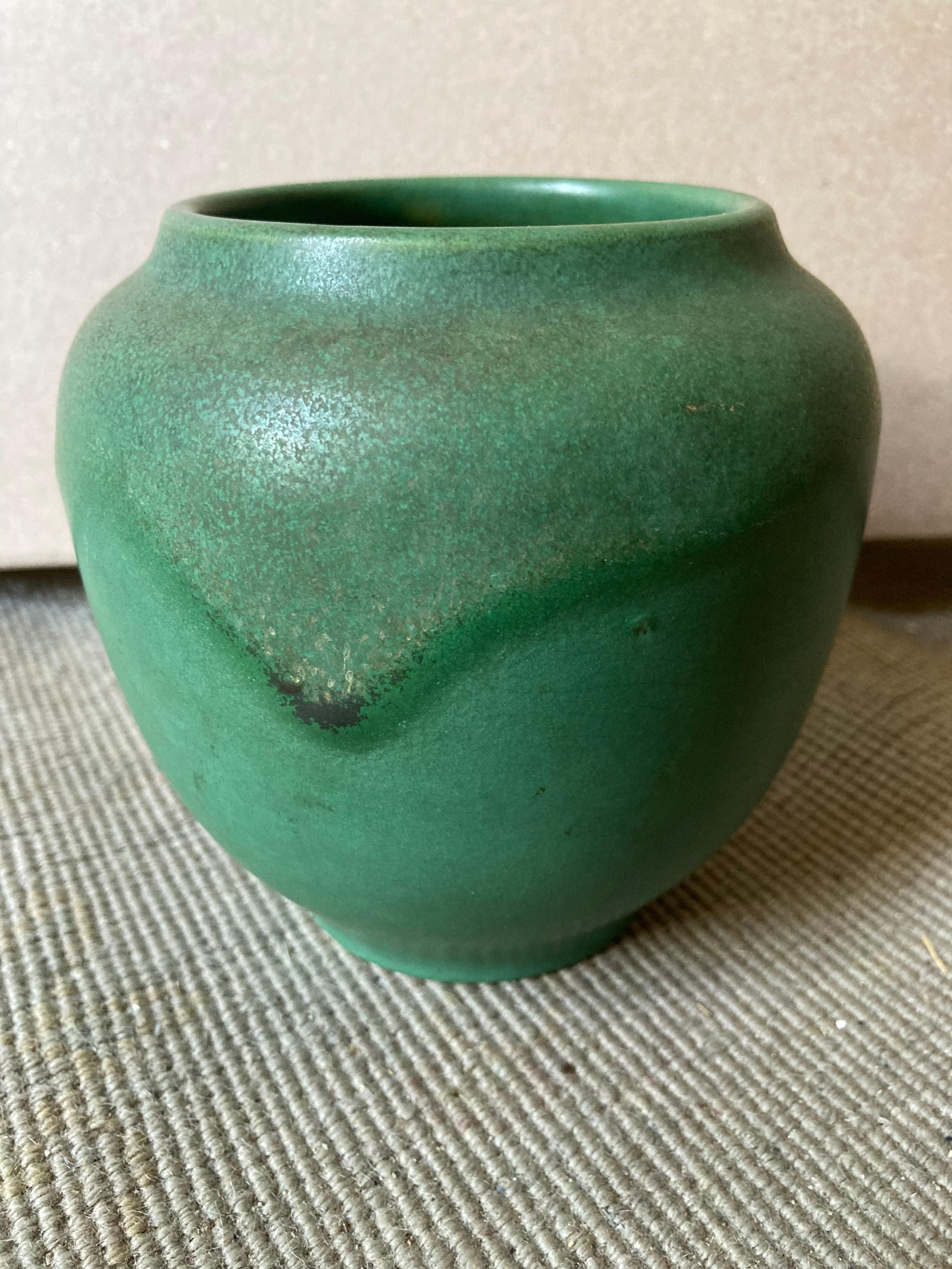 A gorgeous Newcomb Pottery bowl thrown by master potter Joseph Meyer. He was at Newcomb for around 30 years, between 1897 and 1927.  We have included a photo of the marks on the bottom of the bowl: JM for Joseph Meyer, N for Newcomb, and B for