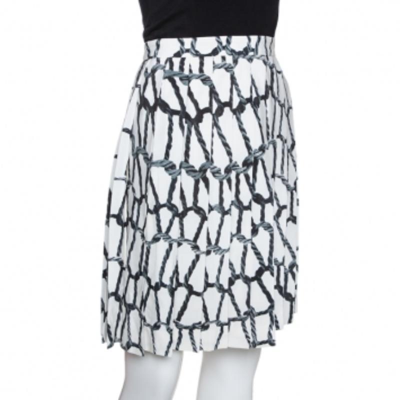 Team this pretty skirt with a simple blouse and glossy footwear to create a stunning look! Tailored from silk, it provides a sophisticated and charming appeal. Designed by Joseph, it looks perfect in its monochrome prints of ropes.
