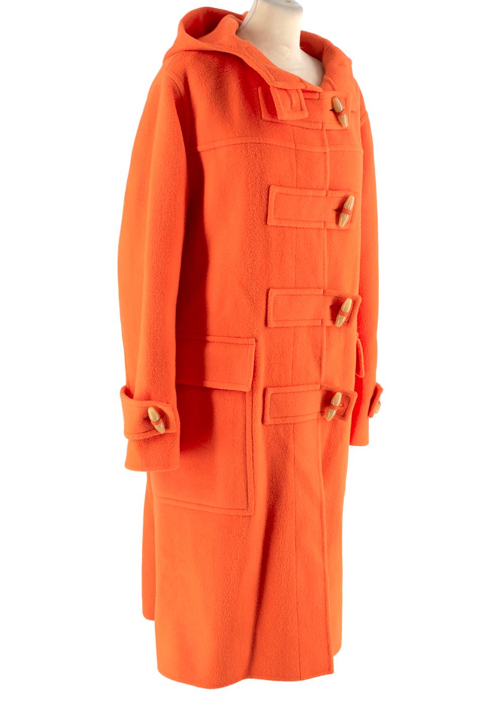 Joseph Orange Maken Wool Duffle Coat 

- Bright orange wool duffle coat featuring a hood and toggle closure at front with tabs and toggle accents at cuffs
- Front flap pockets 
- Rear sewn in belt with toggles
- Partially lined 
- Perfect for the