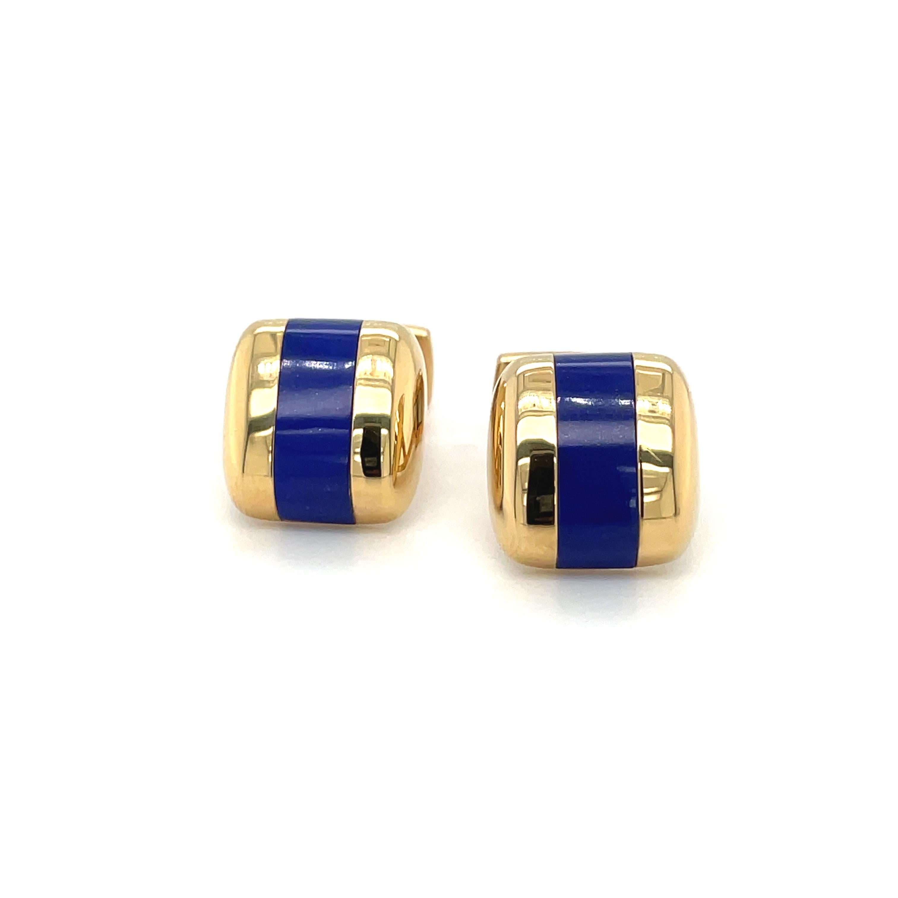 Elegant pillow shaped 18 karat yellow gold cuff links. Crafted in a high polished yellow gold with an inlaid lapis lazuli center. The  bar back style cuff links measure 15.8 x 15 x 5.5 mm.
Stamped Germany 18K
