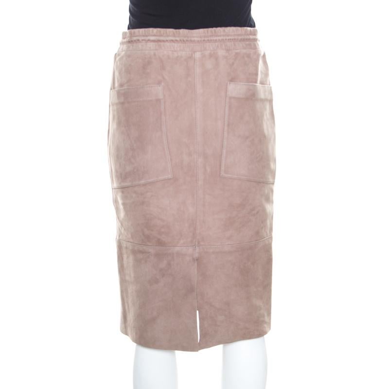This pencil skirt from Joseph is sure to add oodles of style to your wardrobe! The rose taupe creation is made of 100% lambskin and features a simple structured silhouette. It comes equipped with a drawstring closure and four external pockets. Pair