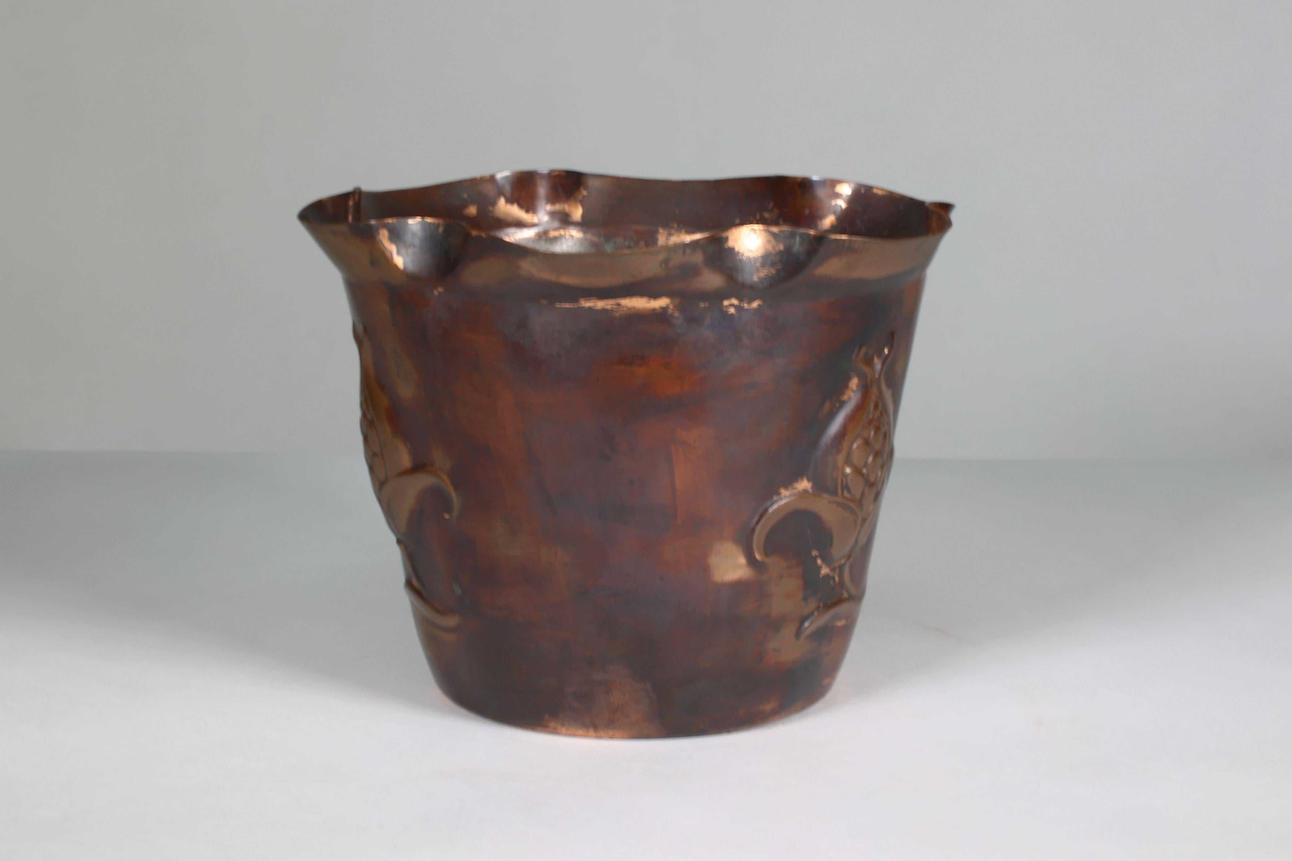 Early 20th Century Joseph Sankey & Sons. An Arts & Crafts copper planter with embossed flower pod For Sale