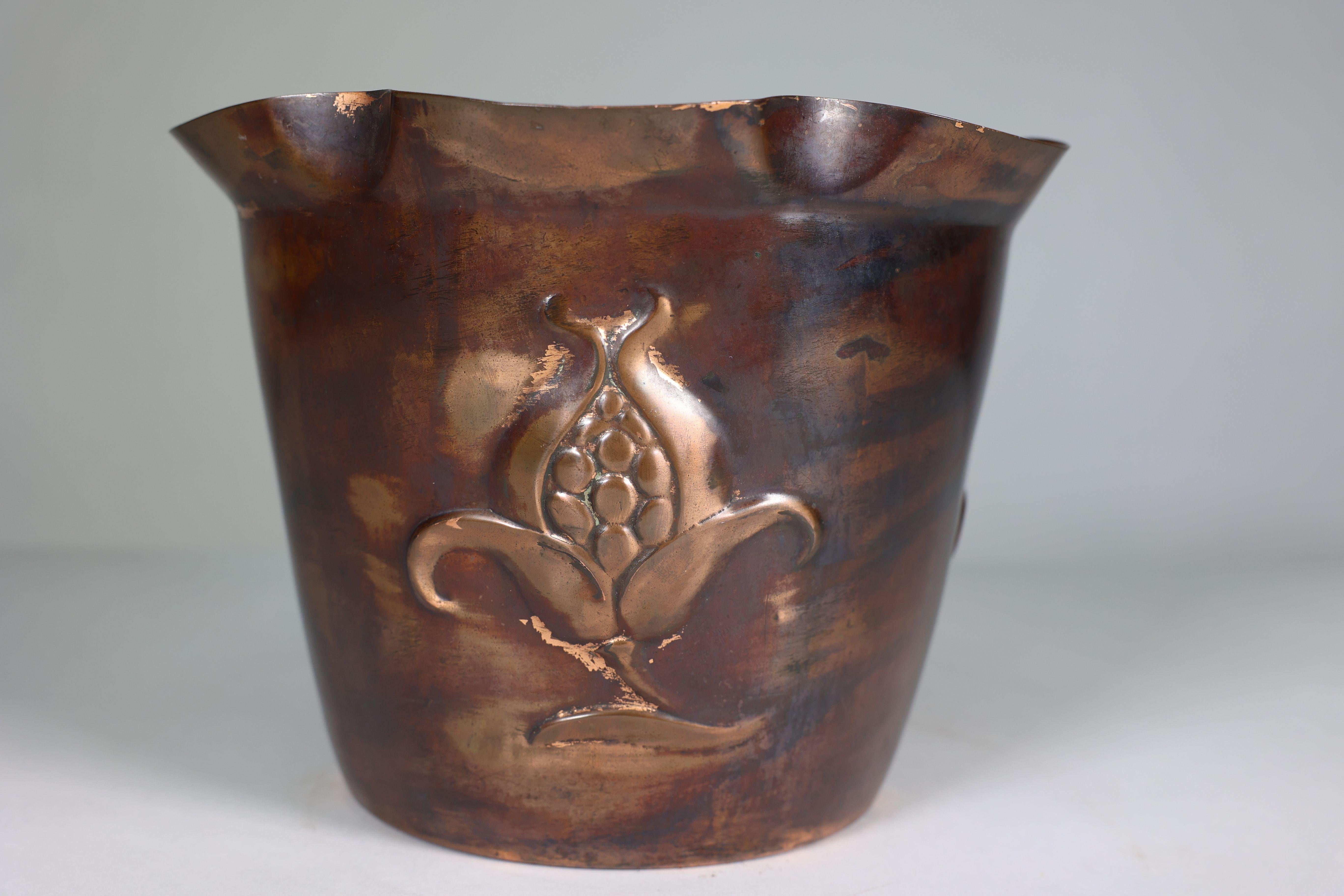 Copper Joseph Sankey & Sons. An Arts & Crafts copper planter with embossed flower pod For Sale