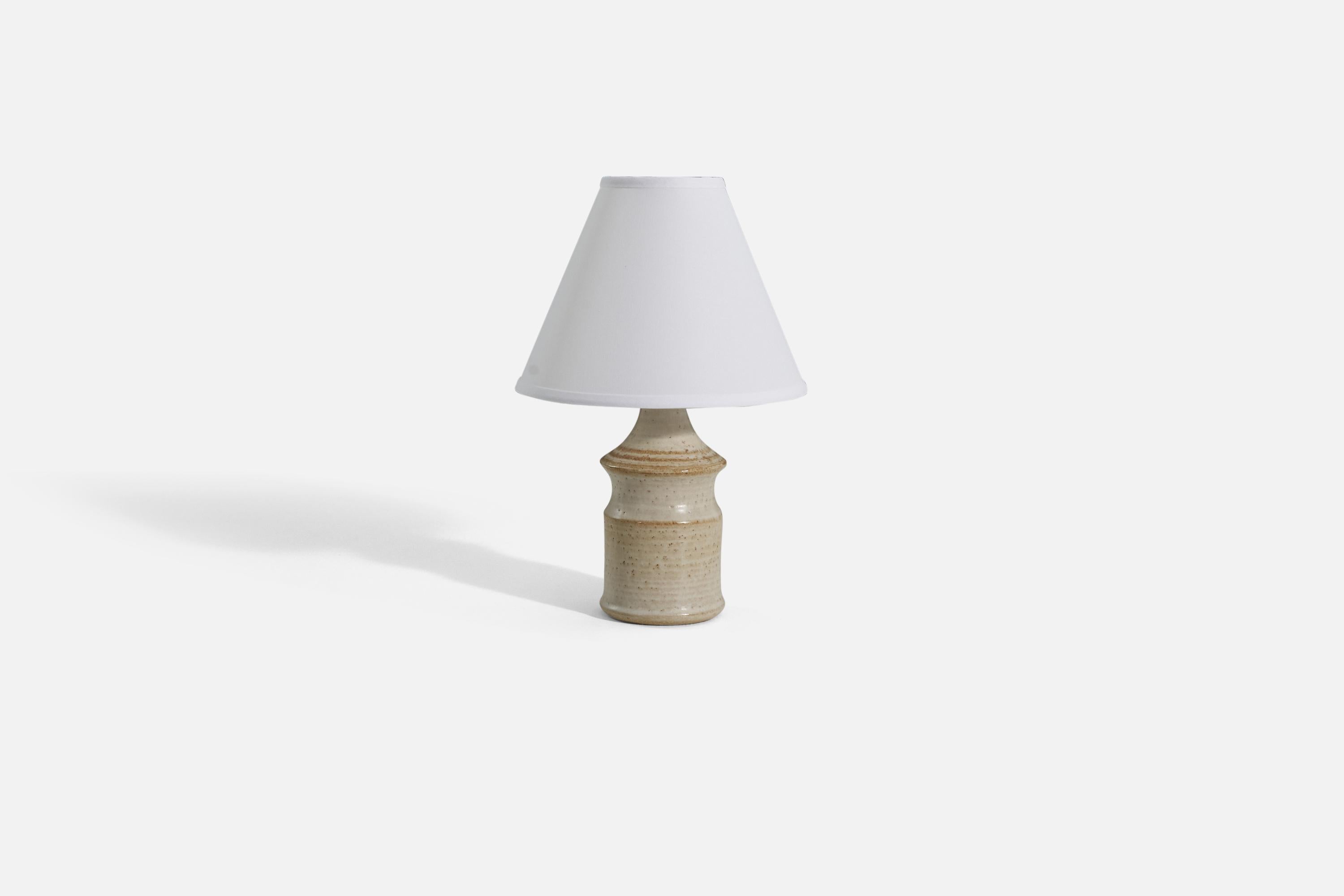 An off-white and brown striped table lamp produced by Søholm Keramik, located on the island of Bornholm in Denmark. 

Sold without lampshade. 

Dimensions of Lamp (inches) : 12 x 4.5 x 4.5 (H x W x D)
Dimensions Shade (inches) : 4.25 x 10.25 x