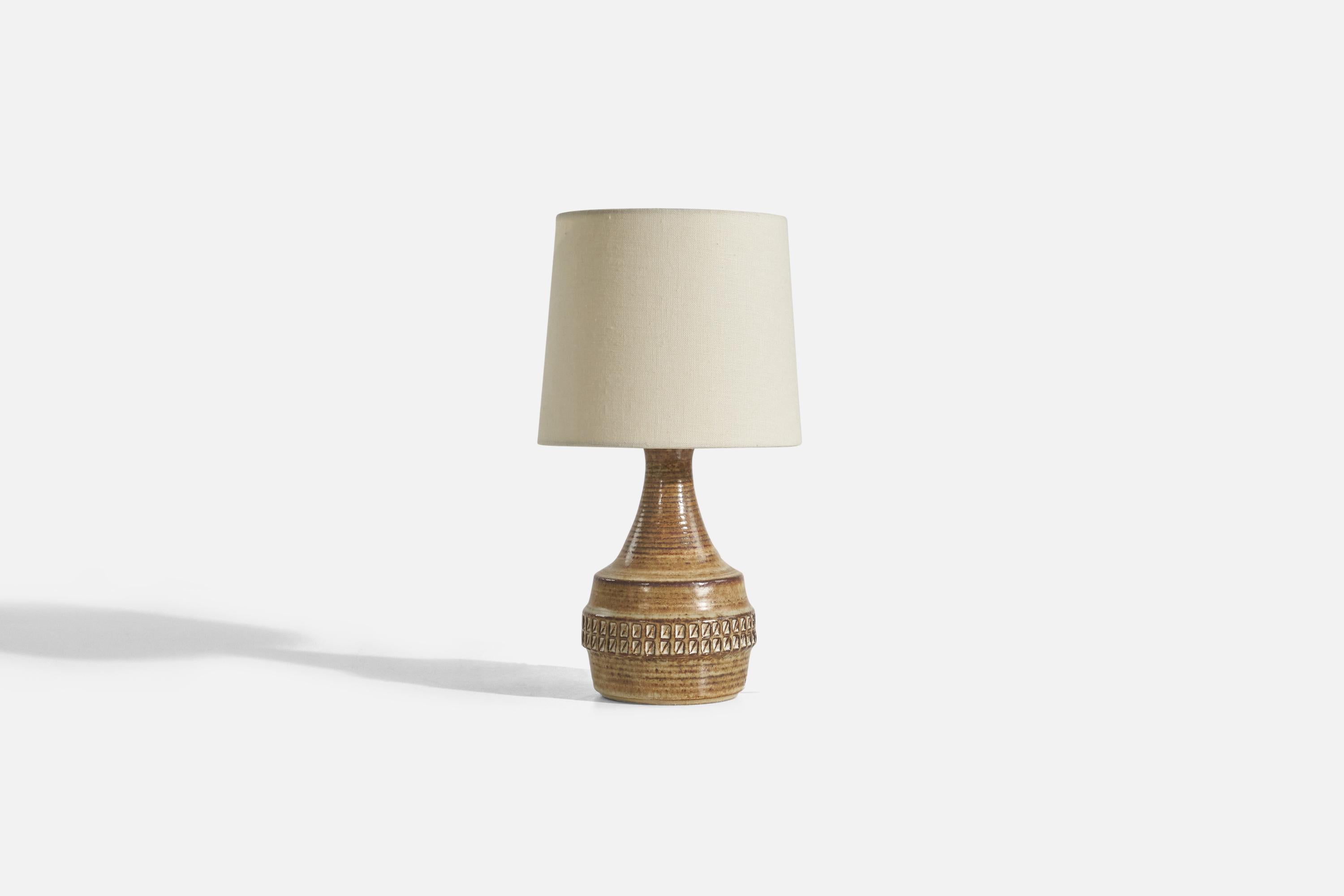 A light brown, glazed stoneware table lamp designed by Joseph Simon and produced by Søholm Keramik, Bornholm, Denmark, 1960s. 

Sold without Lampshade.
Dimensions of Lamp (inches) : 10.5 x 5.37 x 5.37 (Height x Width x Depth)
Dimensions of Shade