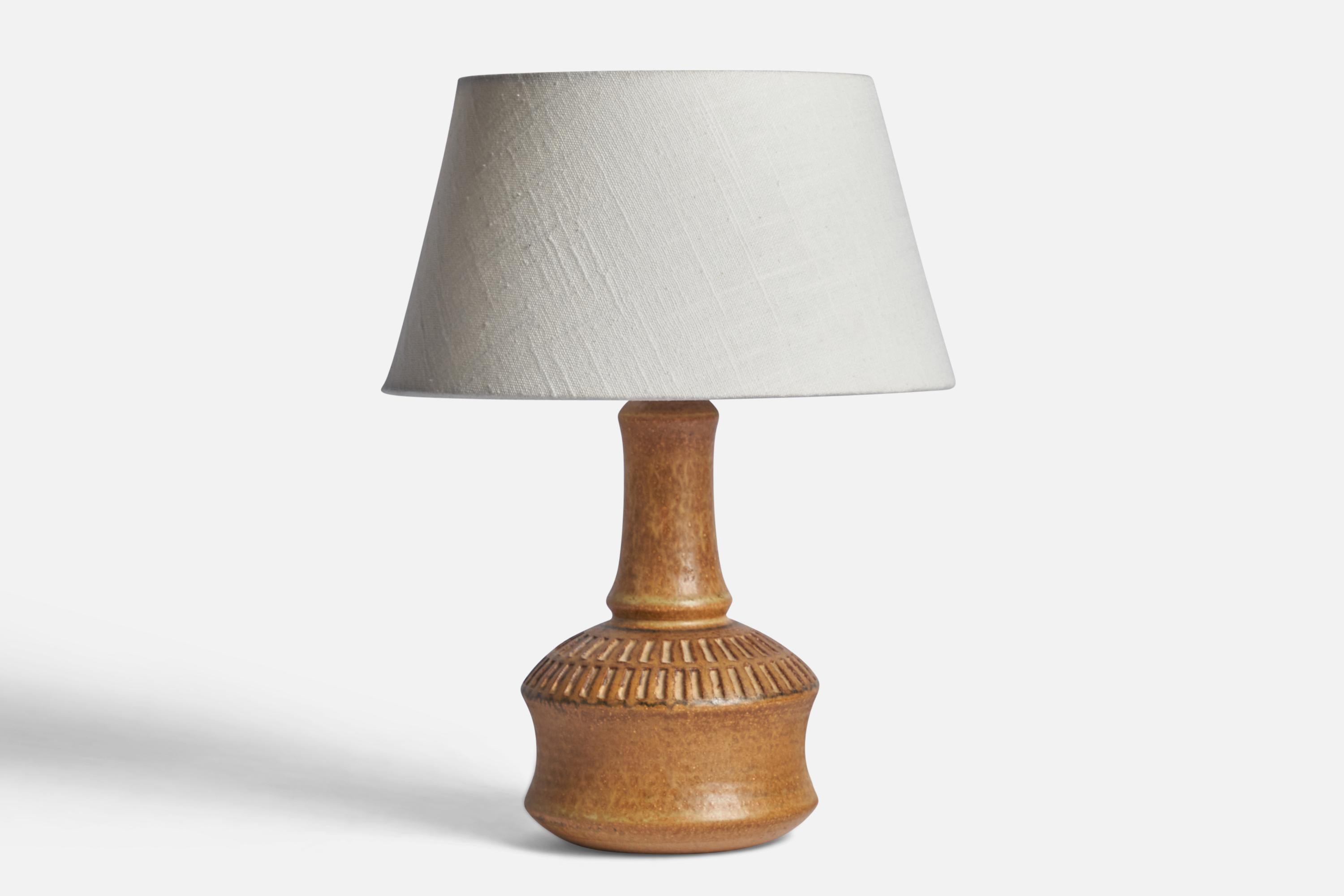 A light brown-glazed stoneware table lamp designed by Joseph Simon and produced by Søholm, Bornholm, Denmark, 1960s.

Dimensions of Lamp (inches): 10.25