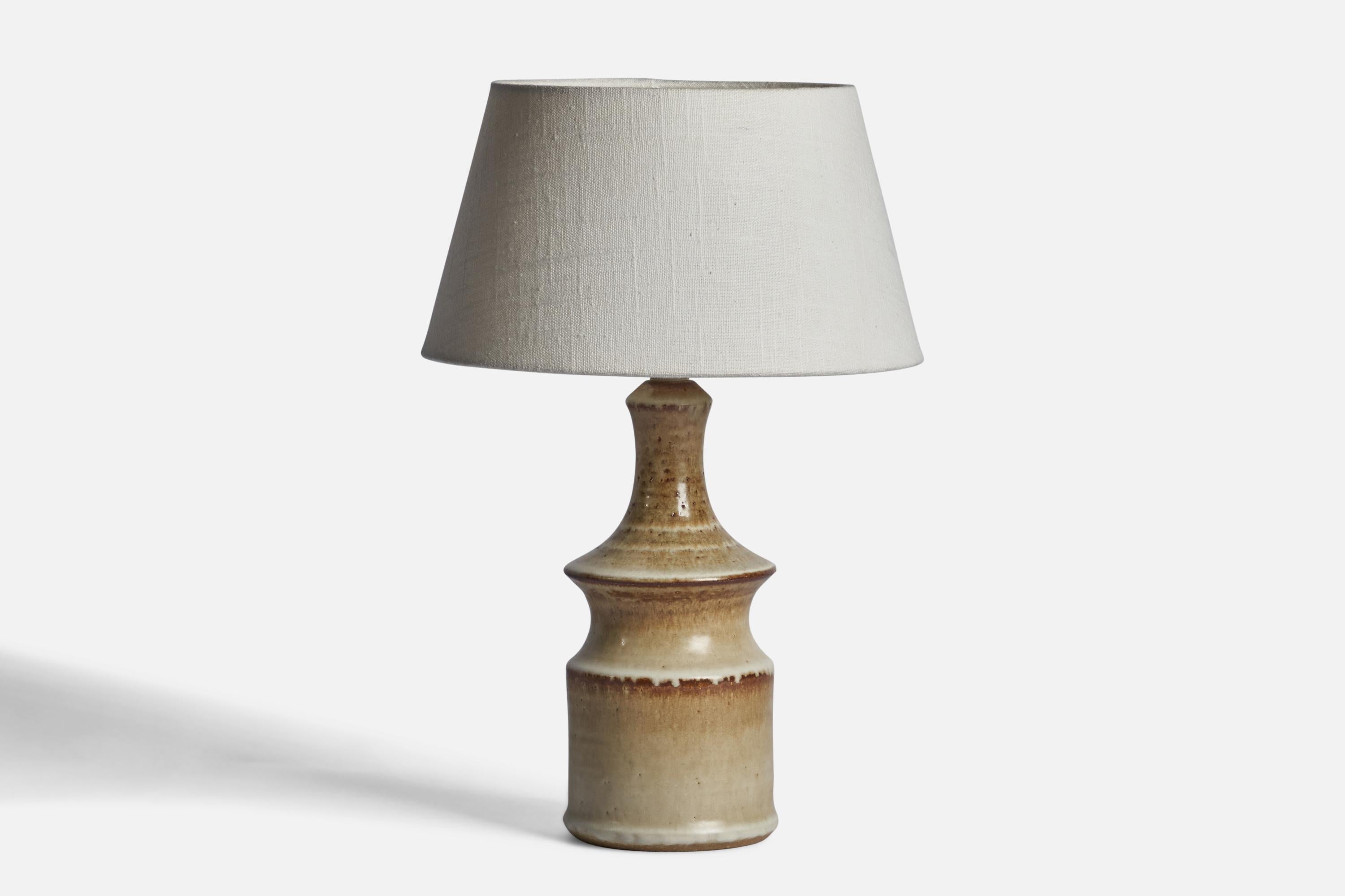 A stoneware table lamp designed by Joseph Simon and produced by Söholm, Denmark, 1960s.

Dimensions of Lamp (inches): 11.5” H x 4.35” Diameter
Dimensions of Shade (inches): 7” Top Diameter x 10” Bottom Diameter x 5.5” H 
Dimensions of Lamp with