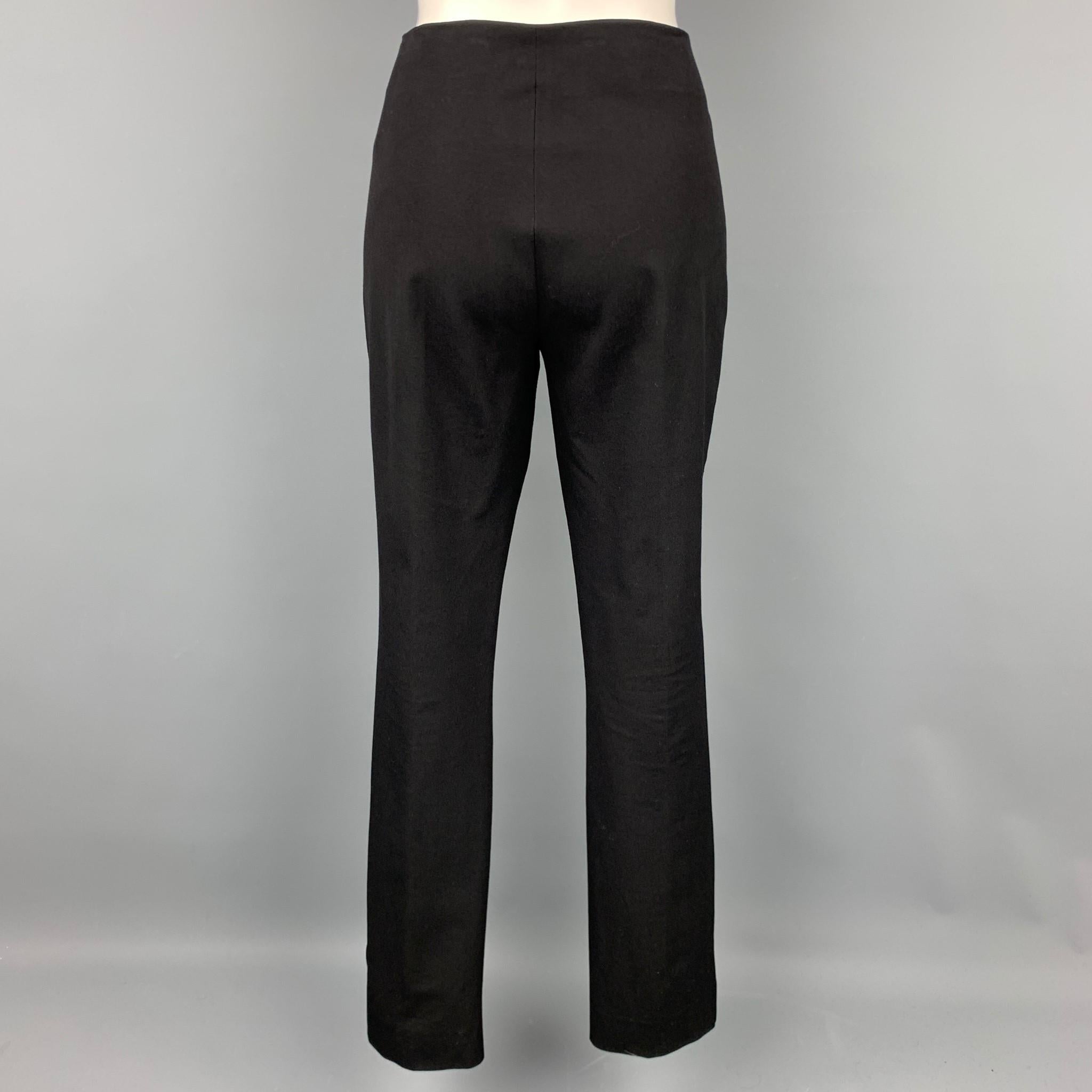 JOSEPH dress pants comes in a black viscose / cotton featuring a narrow leg and a side zip up closure. Made in France.

Very Good Pre-Owned Condition.
Marked: FR 44

Measurements:

Waist: 34 in.
Rise: 8.5 in.
Inseam: 30 in. 
