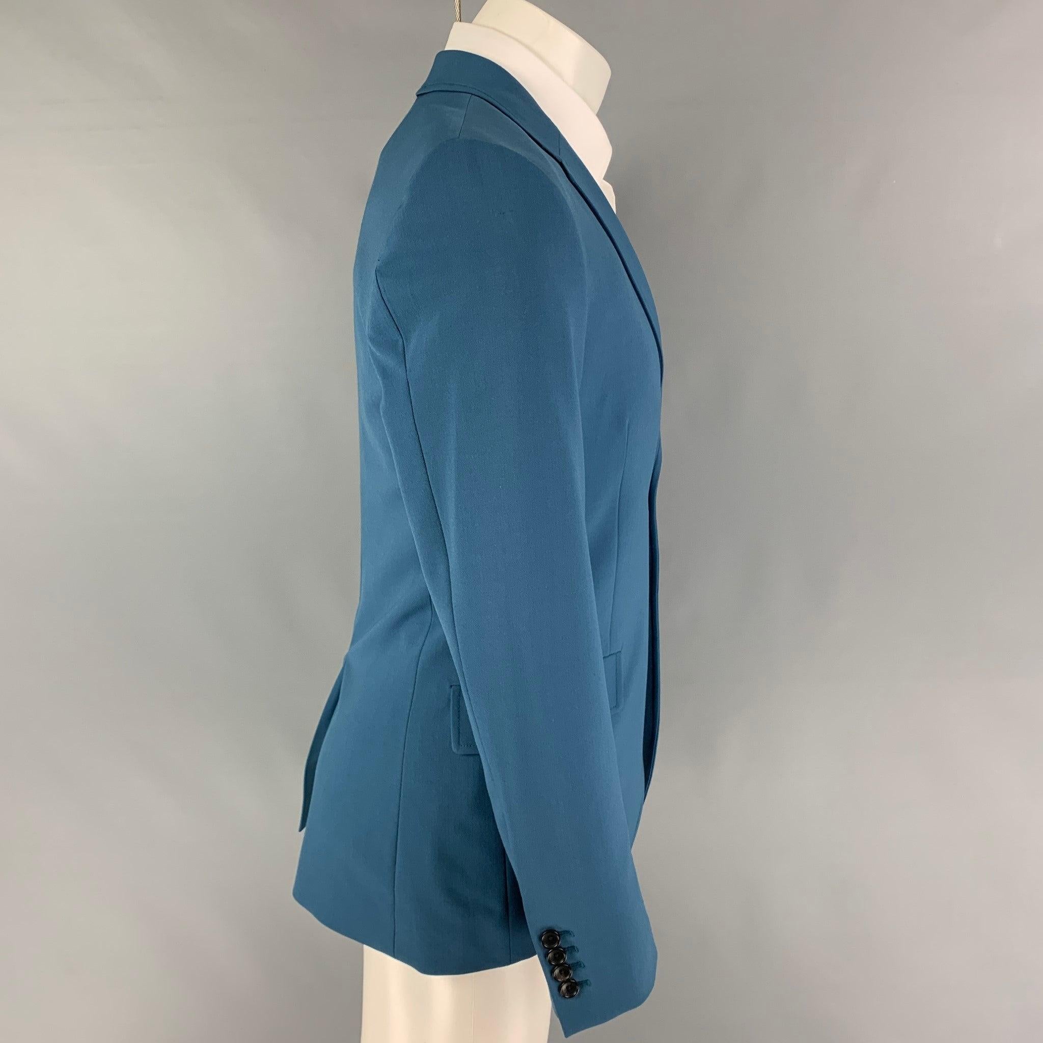 JOSEPH sport coat comes in a teal polyester blend with a full liner featuring a notch lapel, flap pockets, single back vent, and a double button closure. Made in Romania. Very Good
Pre-Owned Condition. 

Marked:   48 

Measurements: 
 
Shoulder:
18