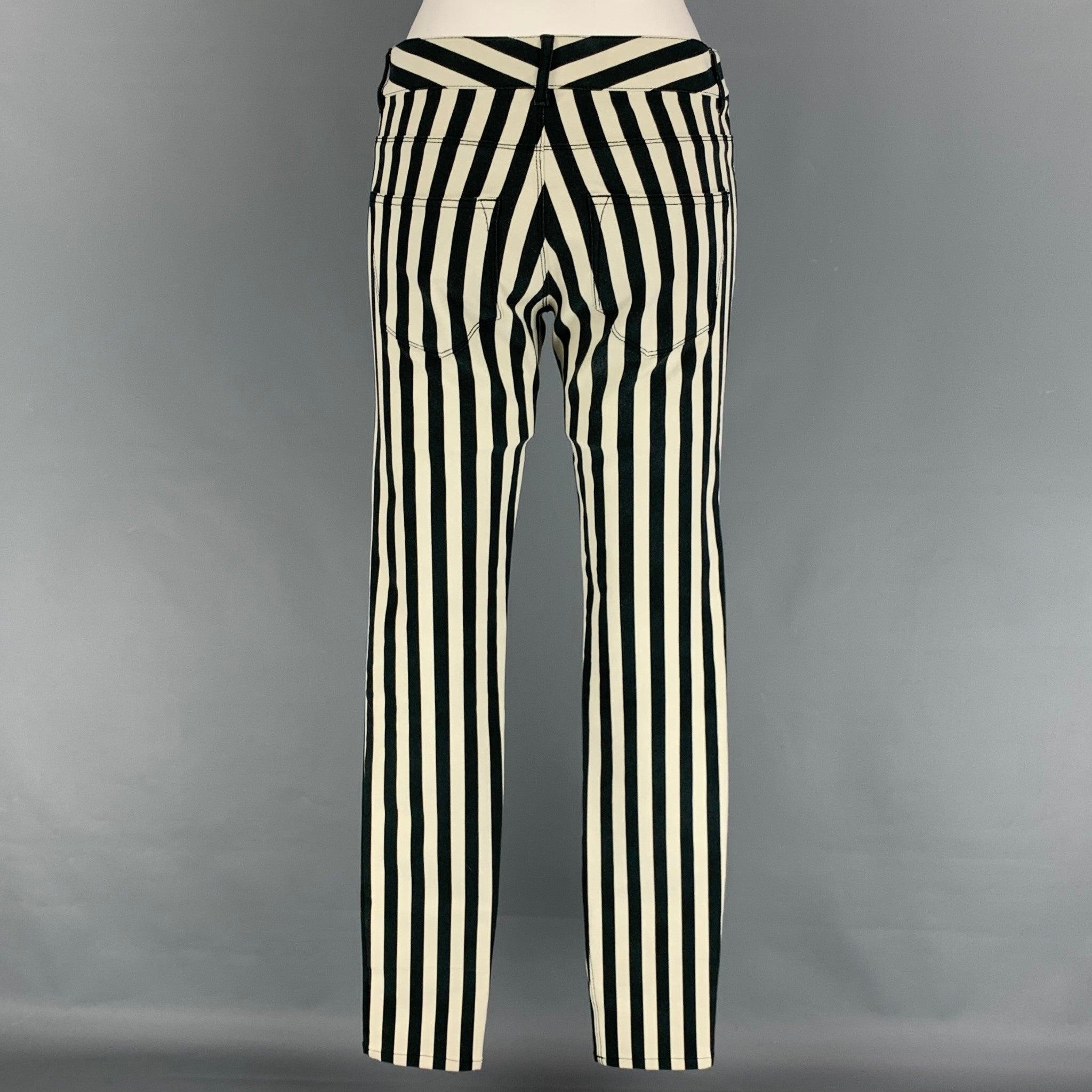 JOSEPH jeans comes in a black & white stripe cotton featuring a skinny fit and a zip fly closure.
Very Good
Pre-Owned Condition. 

Marked:   38 

Measurements: 
  Waist: 30 inches  Rise: 9 inches  Inseam: 35 inches 
  
  
 
Reference: