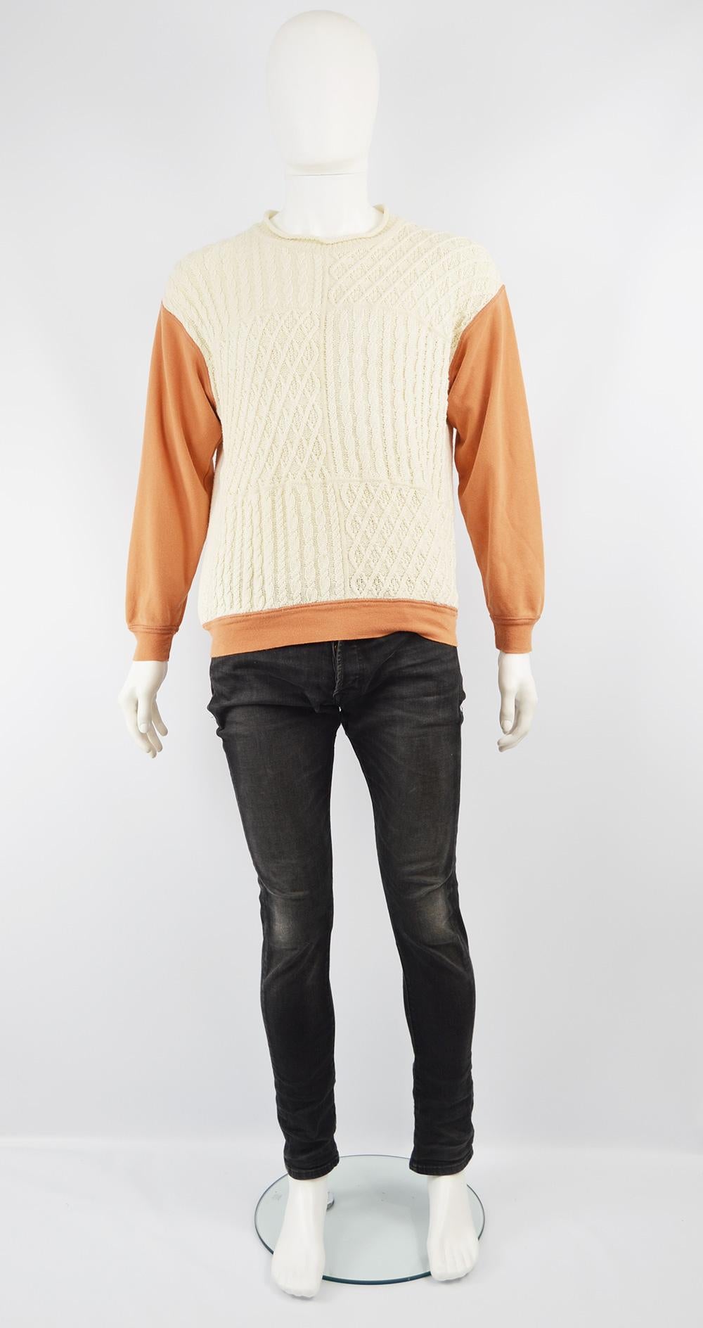 An excellent vintage men's sweater from the 90s by high end and highly collectible British fashion label, Joseph Tricot for their rare Homme line. Made in Italy, with intricate cream cotton cable knit designs on the front and back and an orange
