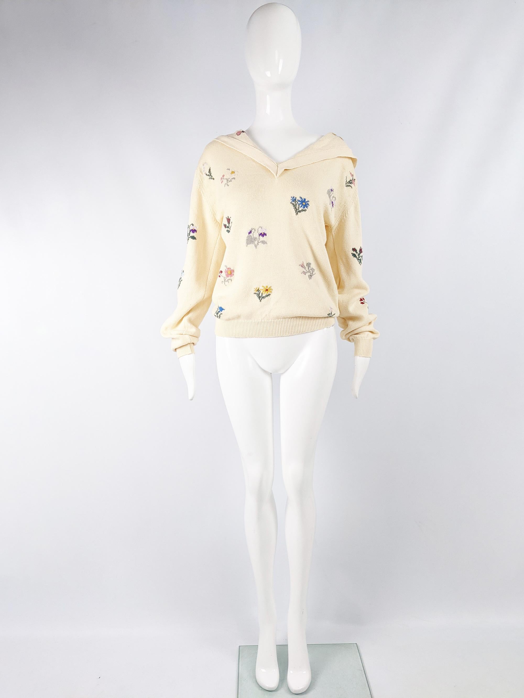 A cute and rare vintage womens Joseph Tricot jumper from the 80s in a cream cotton knit with fabulous flowers and butterflies throughout and a sailor collar.  

Size: Not indicated; fits like a womens Medium. Please check measurements
Bust - 40” /