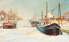 Charming Belgian scene with canal frozen with boats industrial town